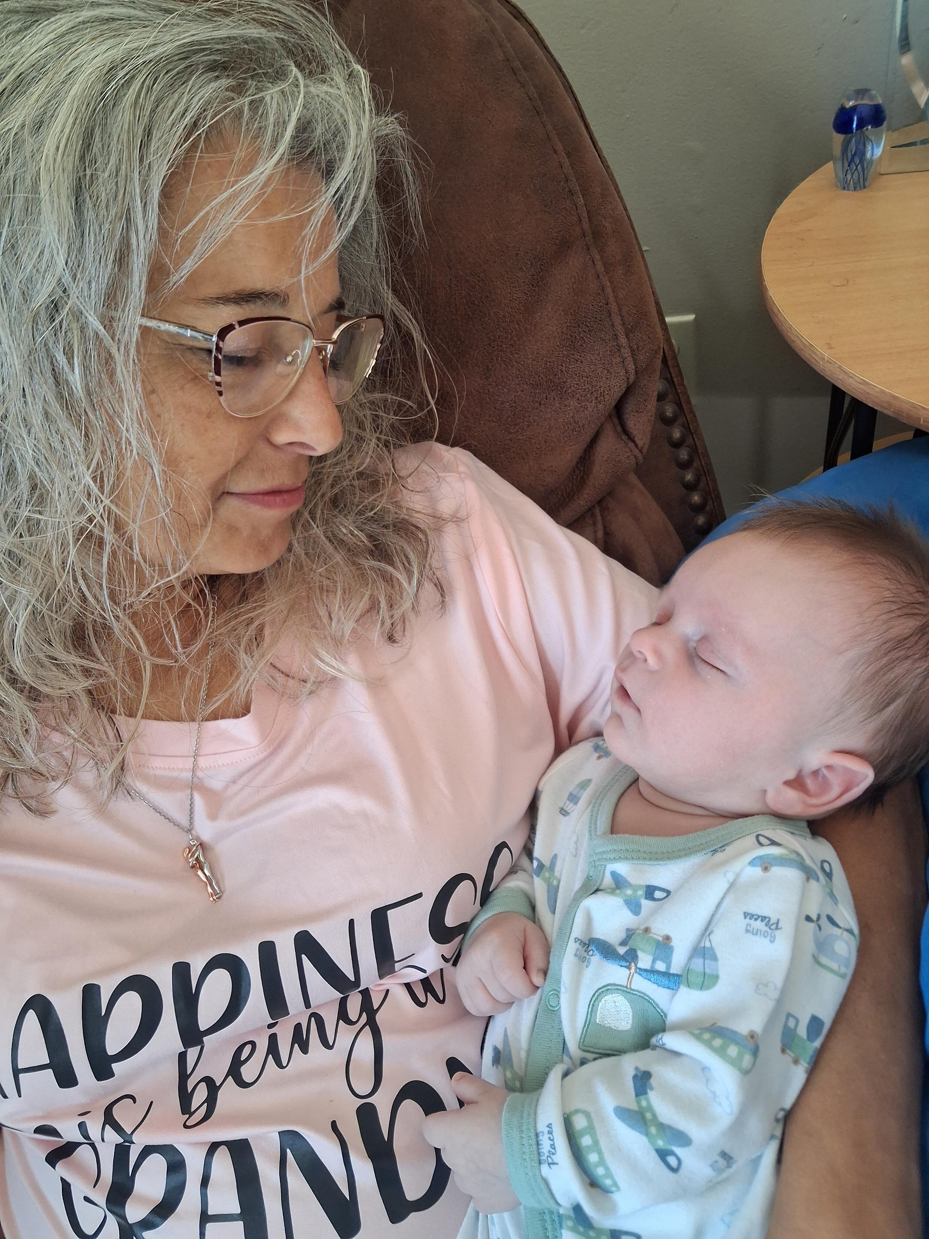 A woman holding a baby