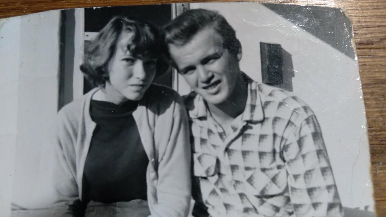 A man and woman posing for a picture