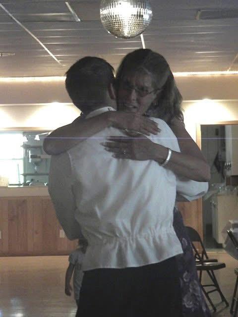 A man and woman hugging