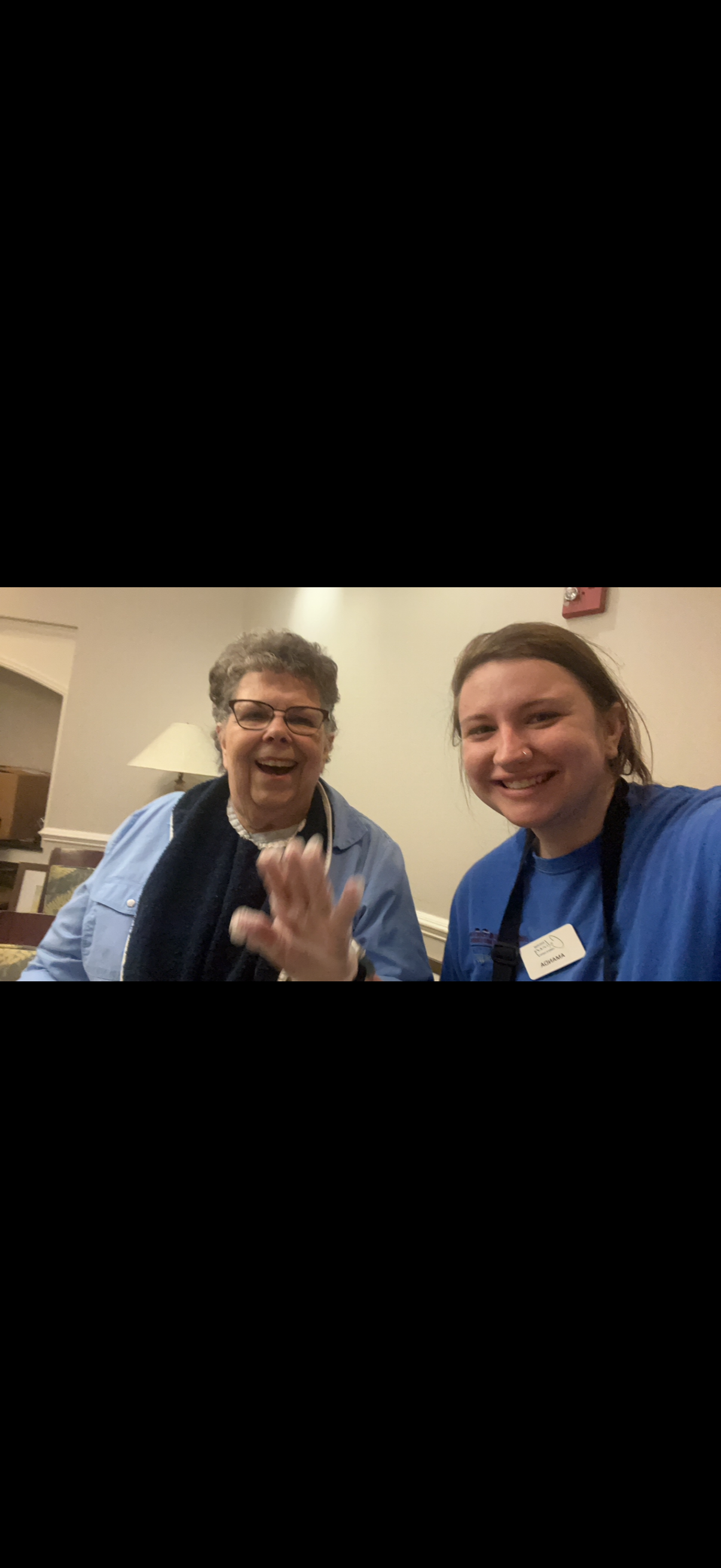 A woman and a woman smiling