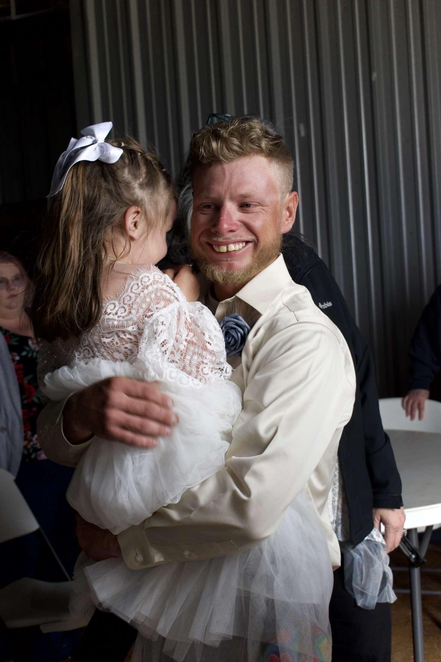 A man holding a girl