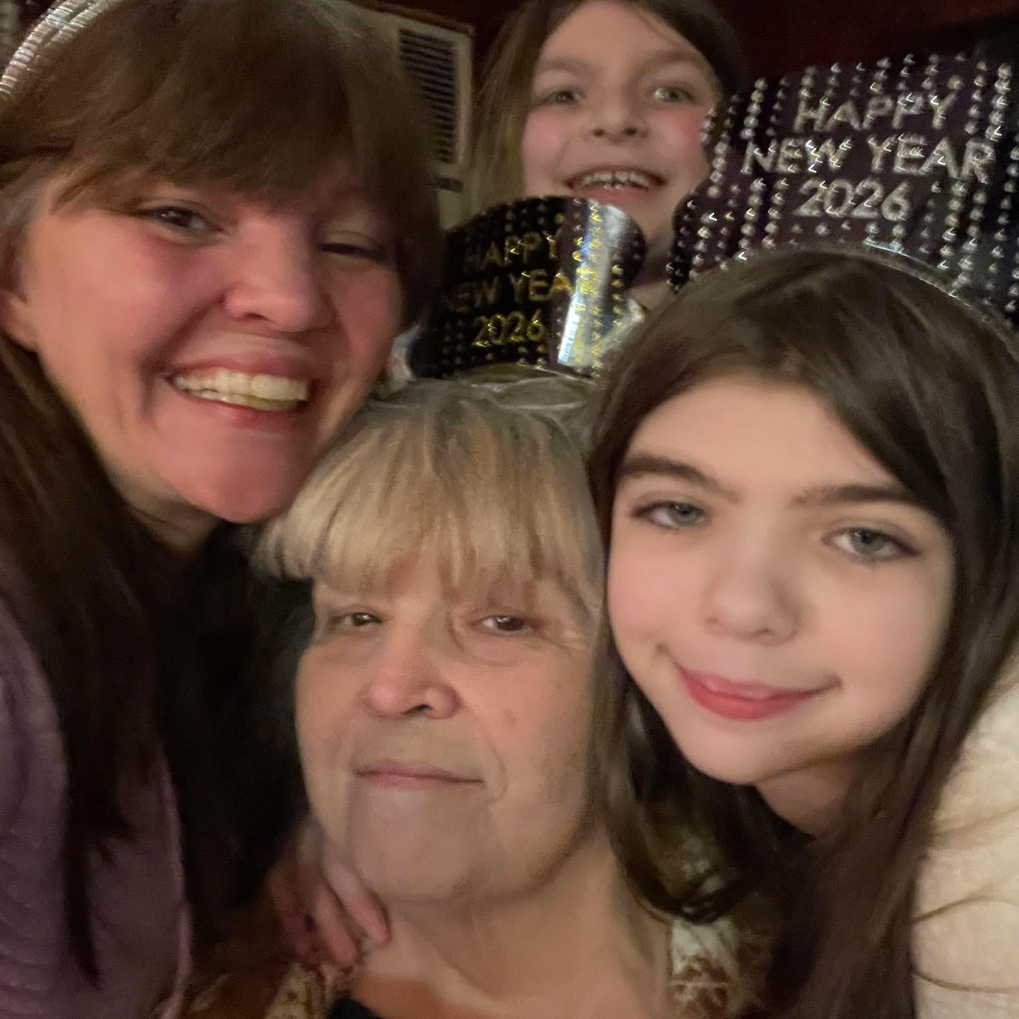 A group of people posing for a selfie