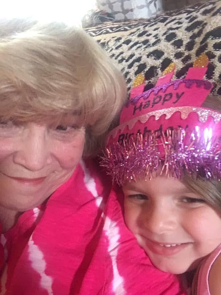 A woman and a child posing for a selfie