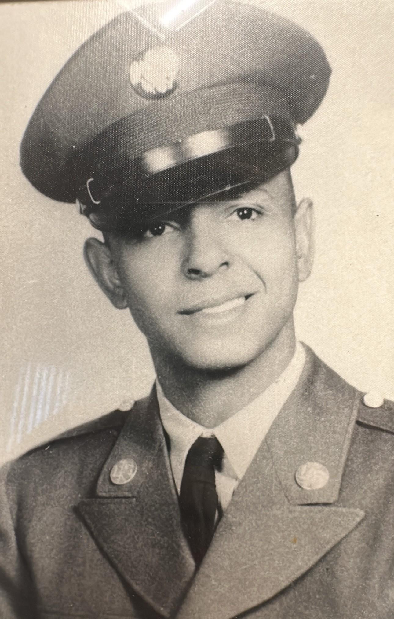A man in uniform and tie