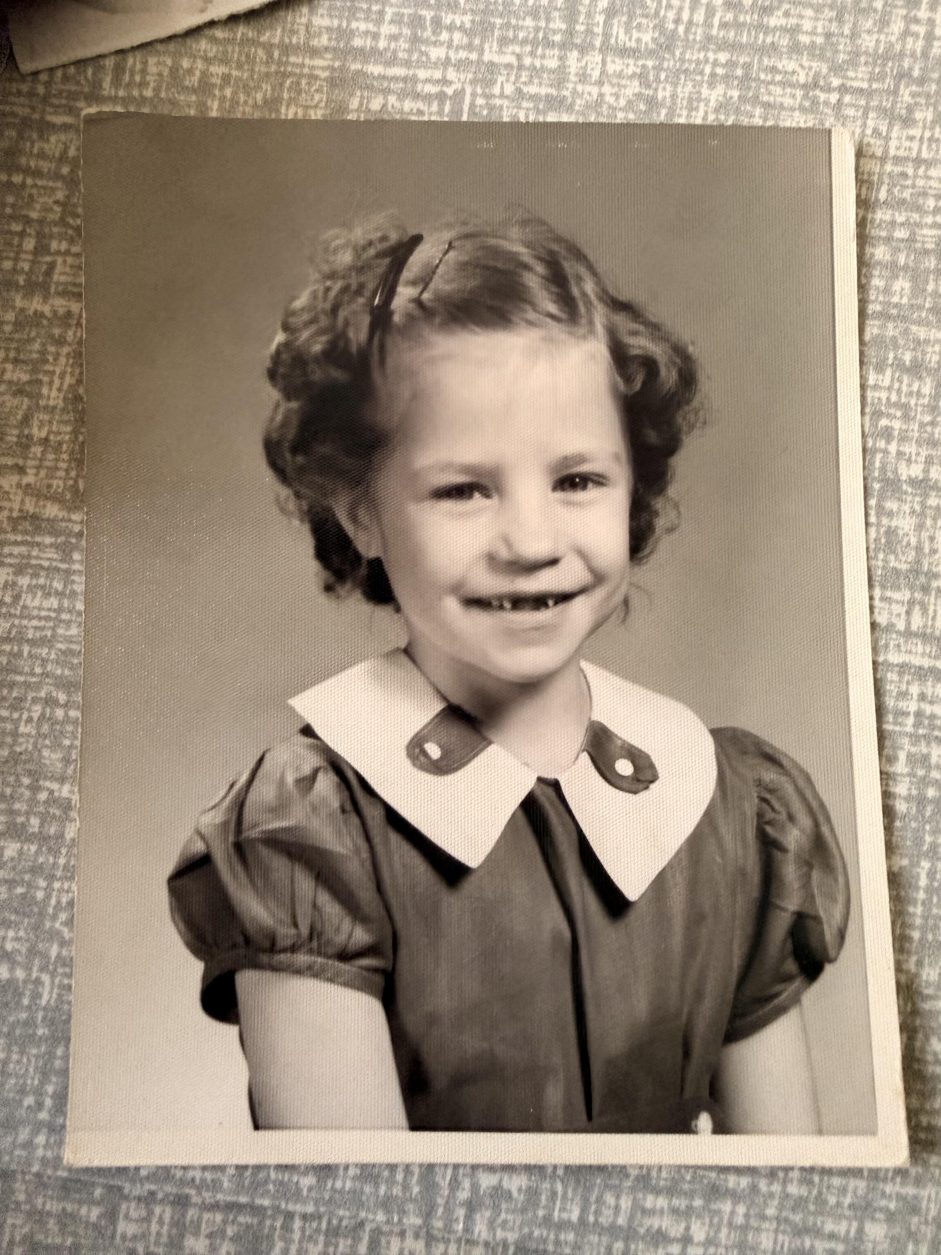 A black and white photo of a young girl