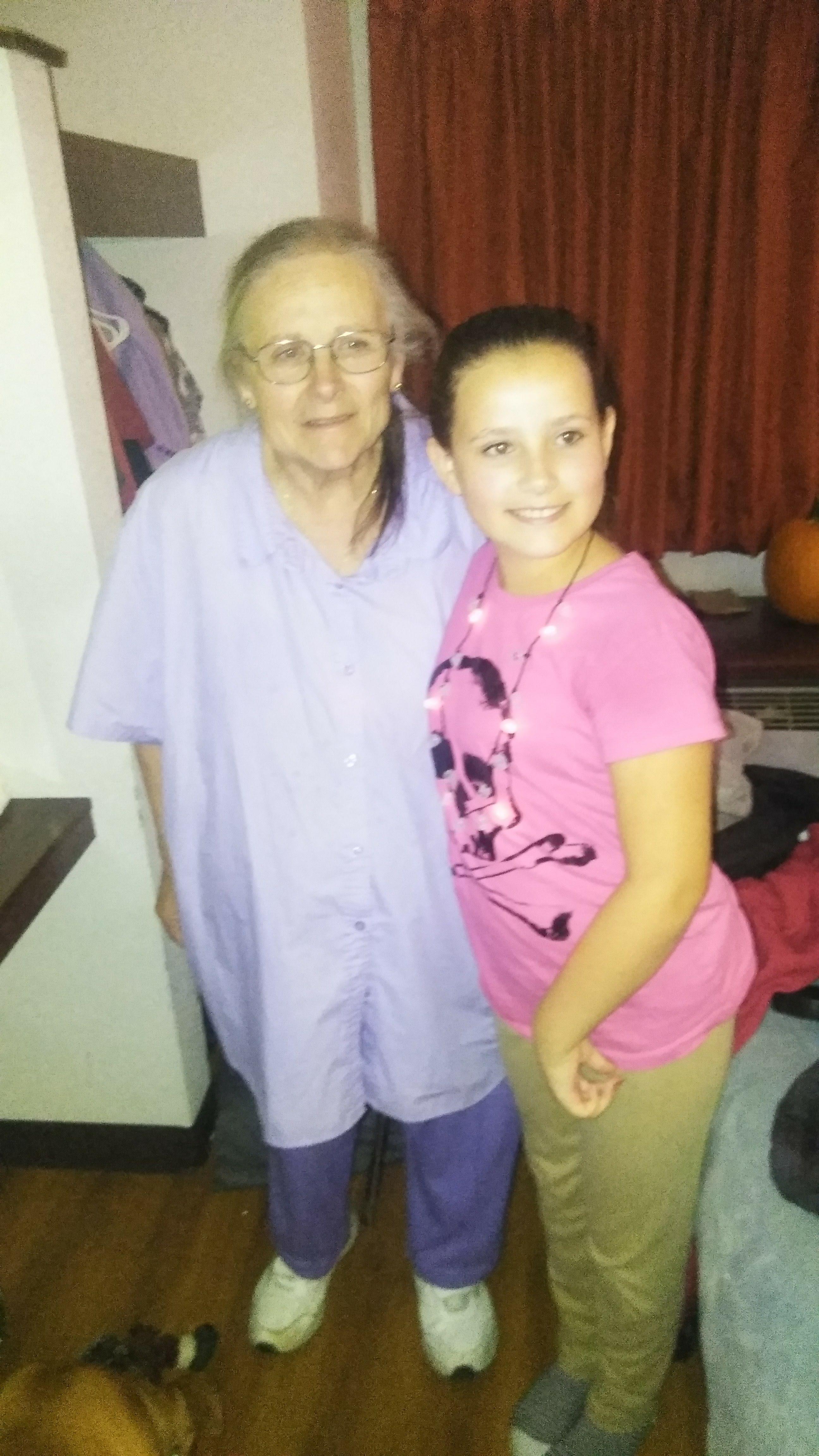 A woman and a girl posing for a picture