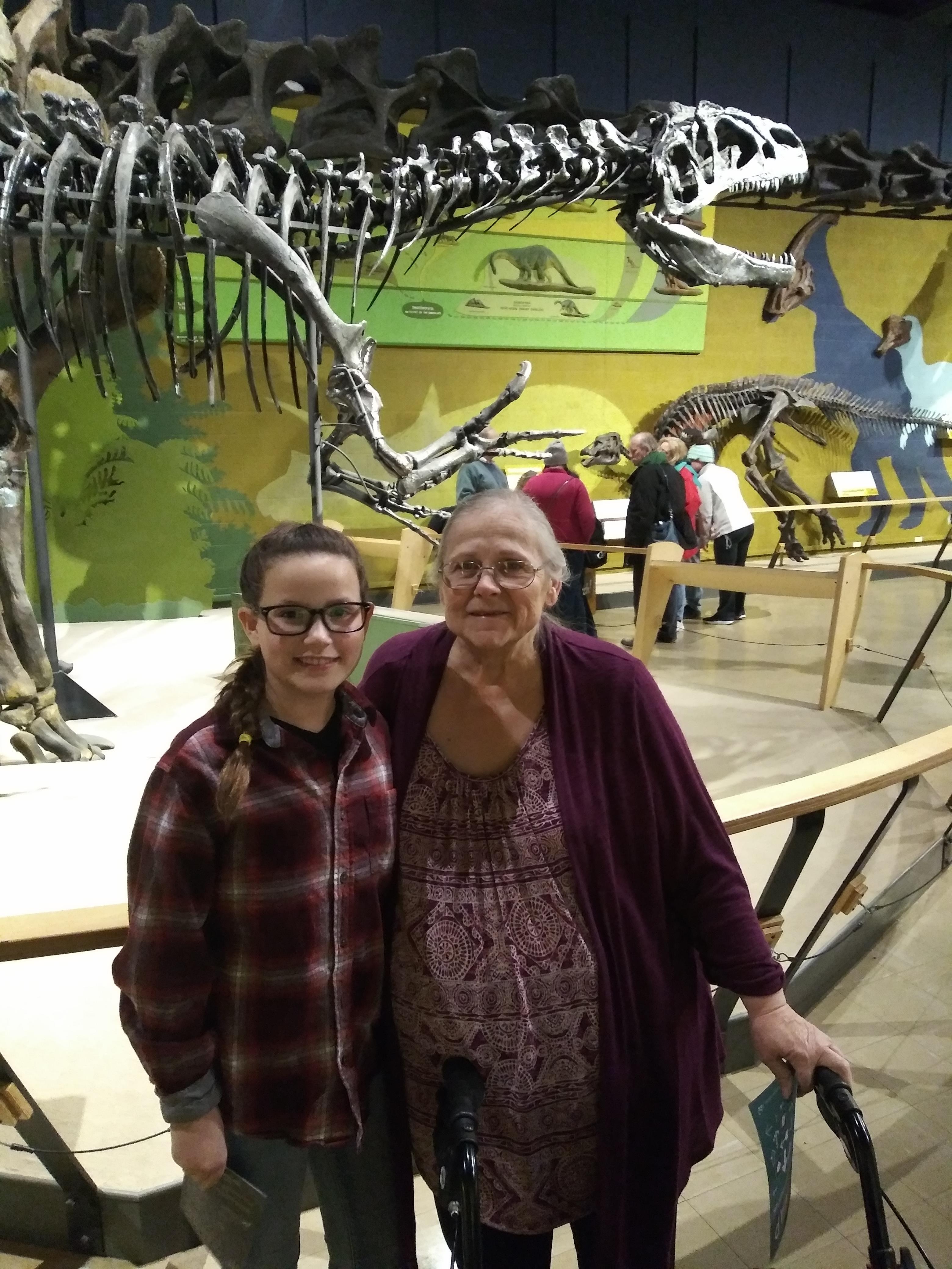 A woman and girl posing for a picture