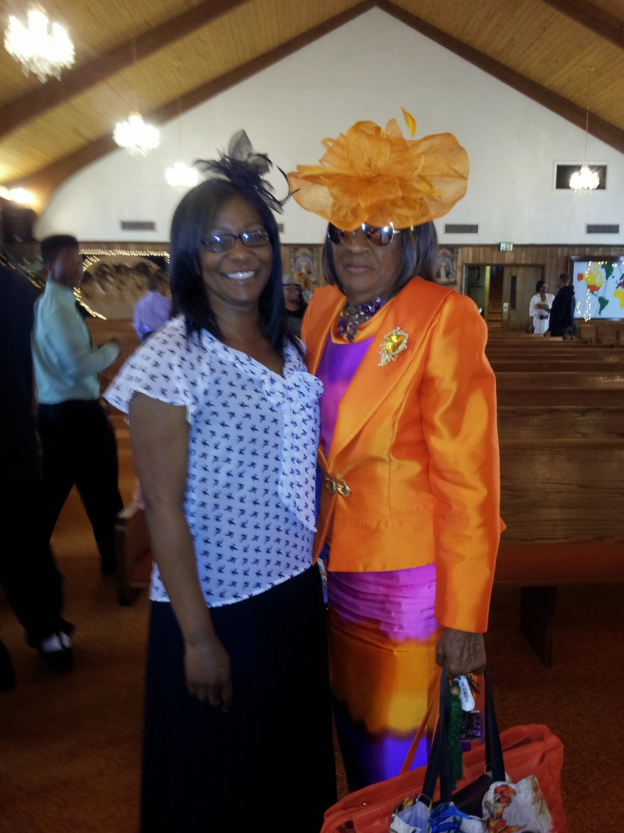 Two women standing together in a church