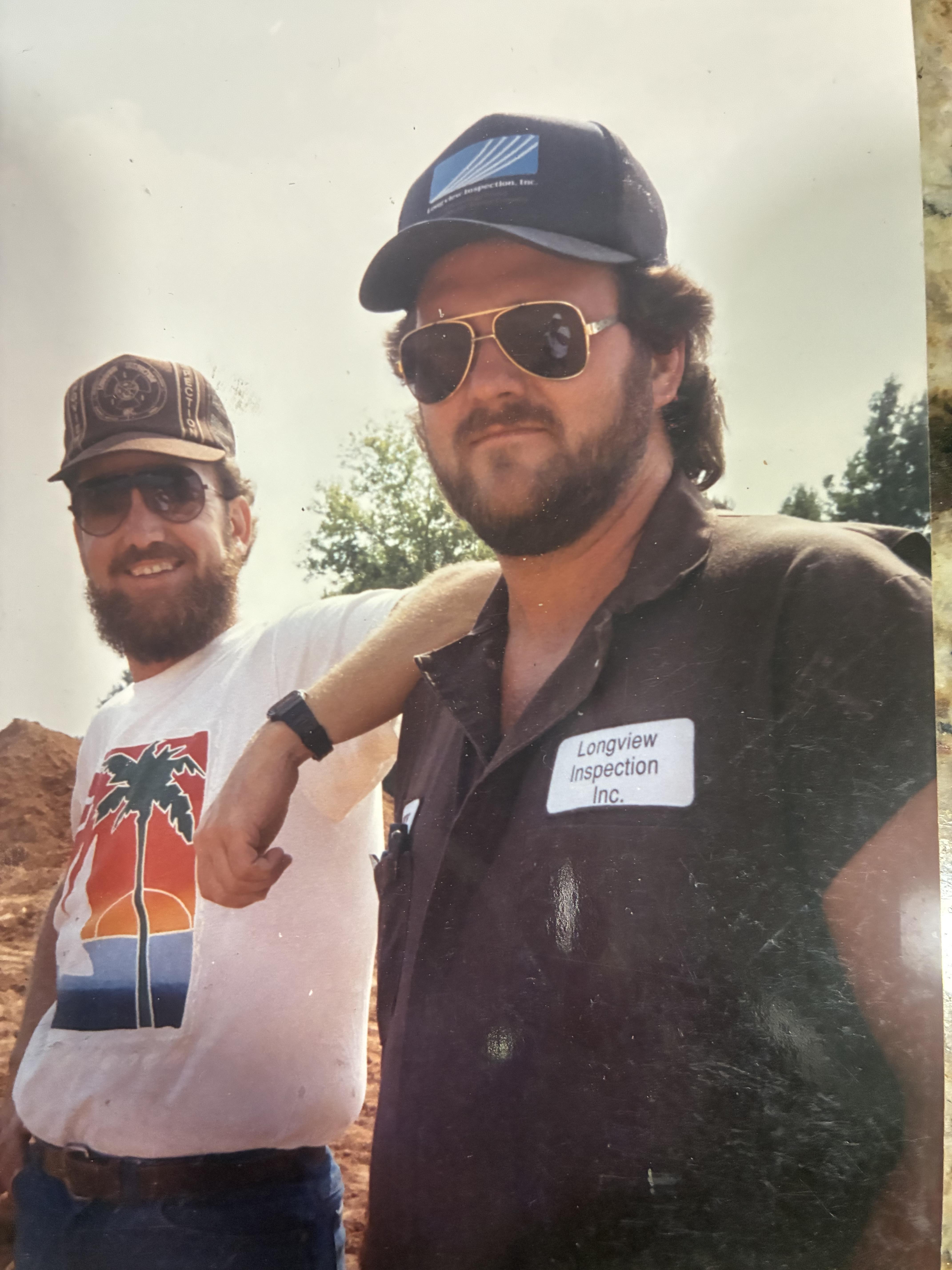 A group of men posing for a picture