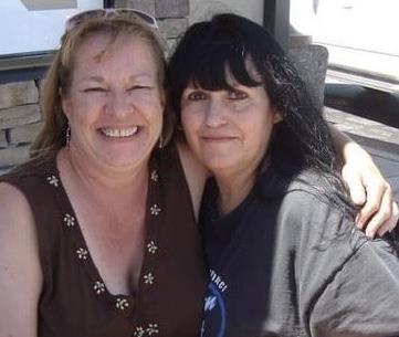 Two women smiling at the camera