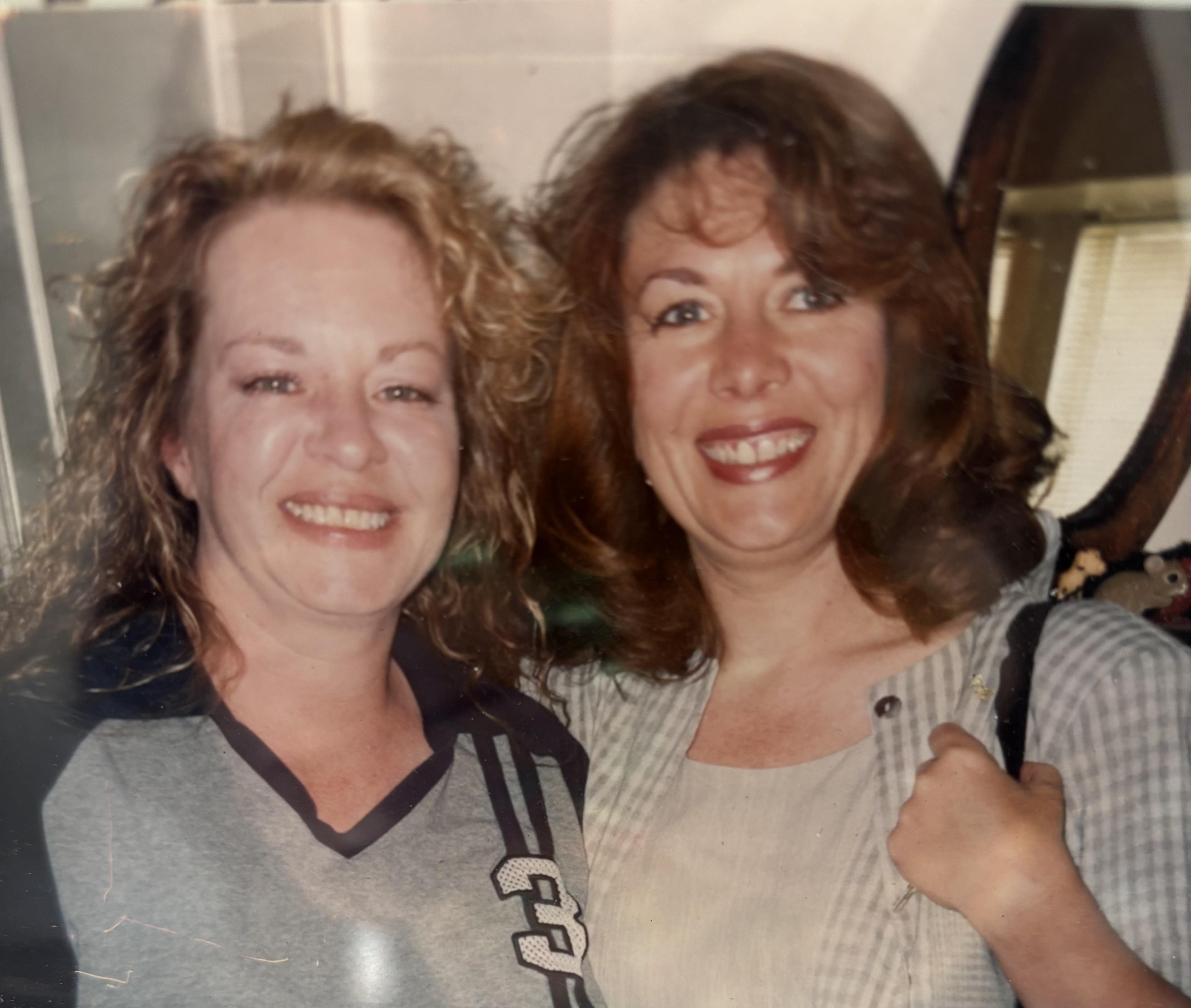 A couple of women smiling