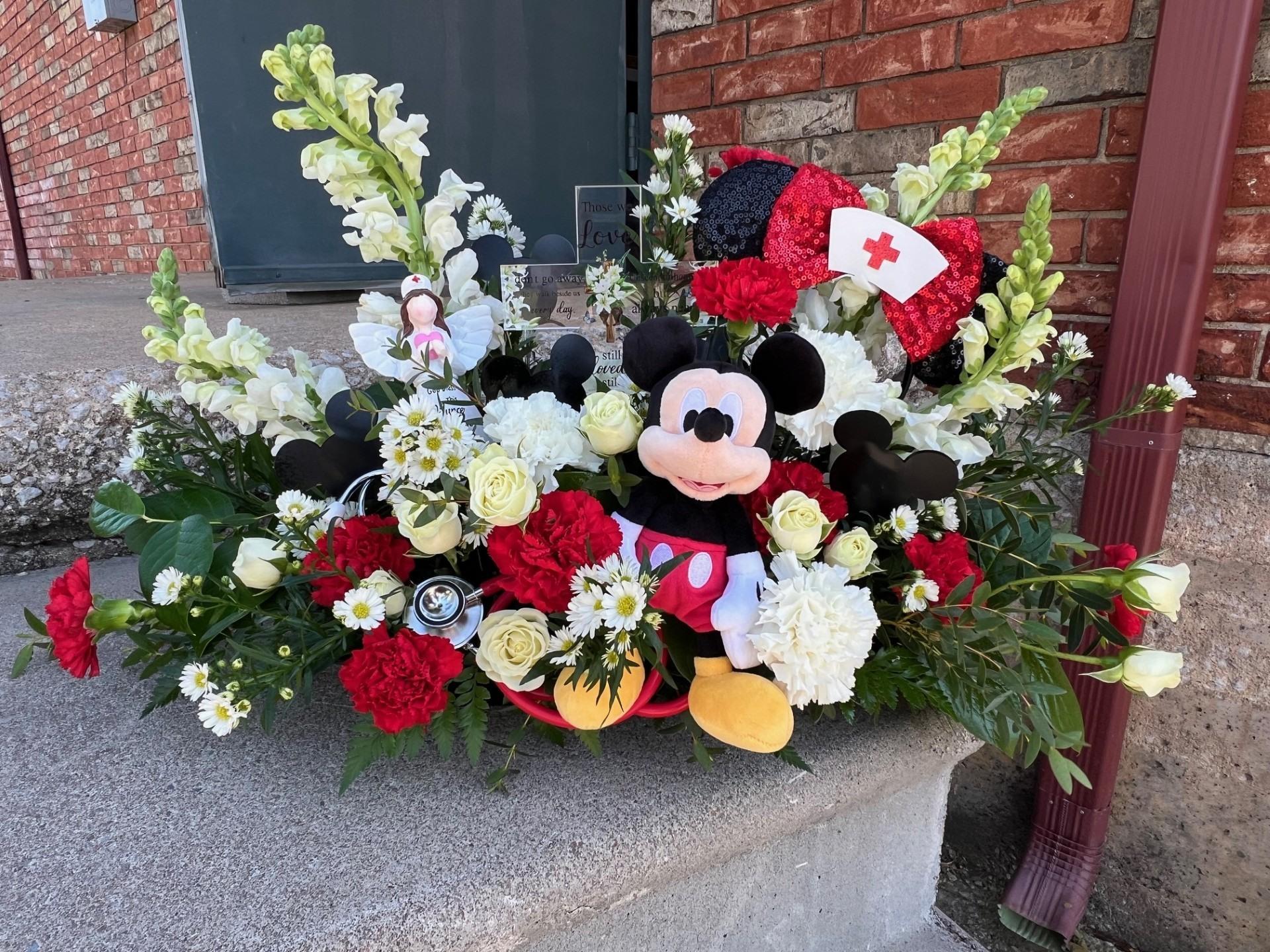 A bouquet of flowers on a concrete ledge