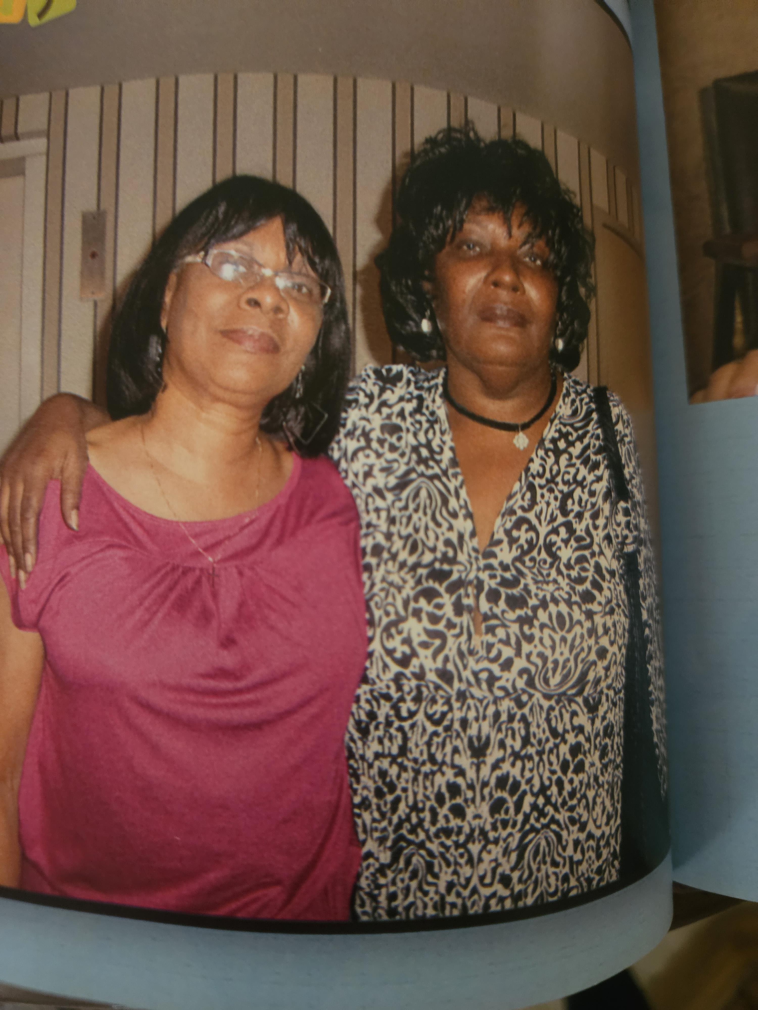 A couple of women posing for a picture