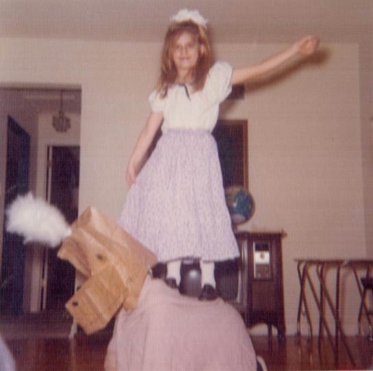 A girl riding a horse