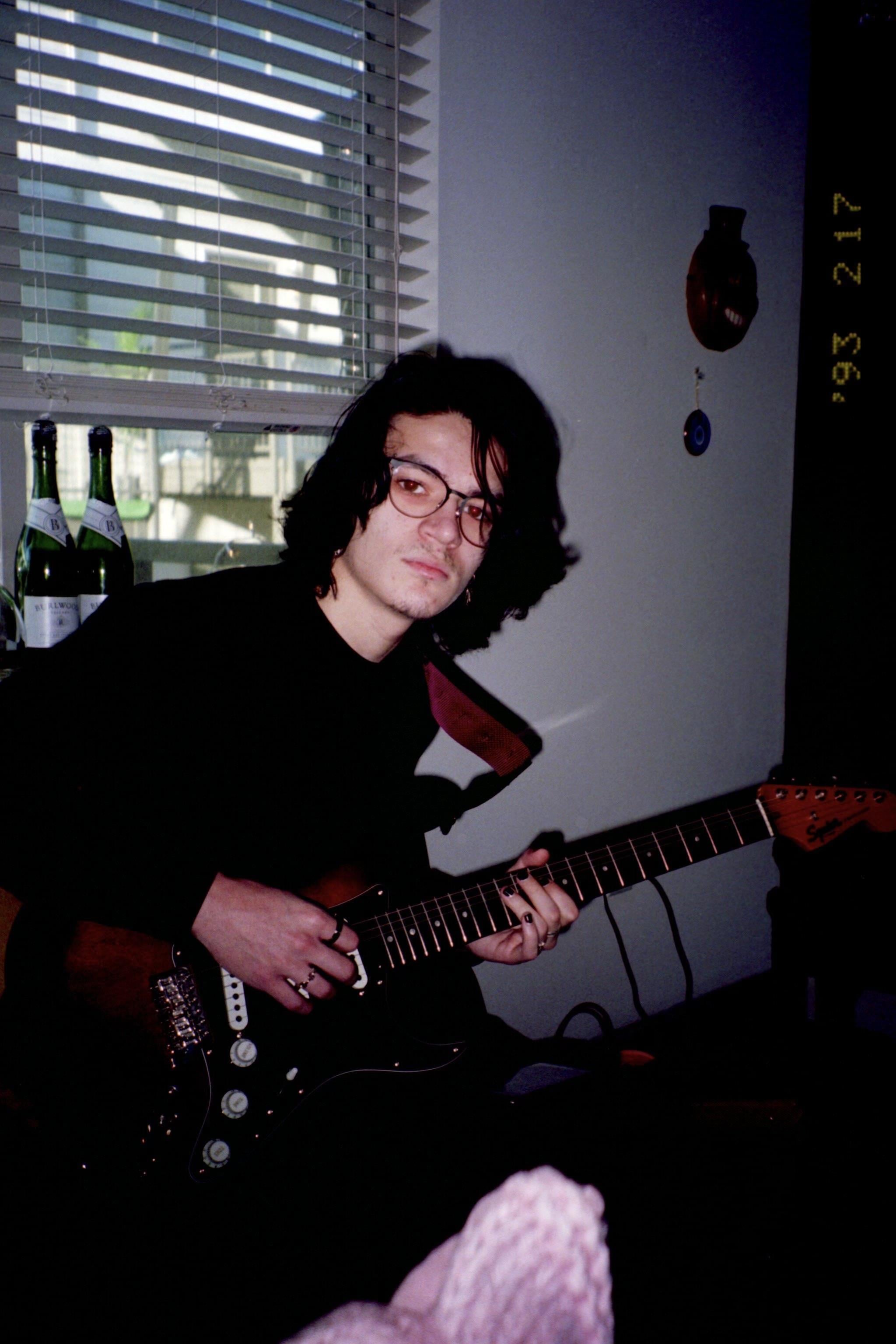 A man playing a guitar