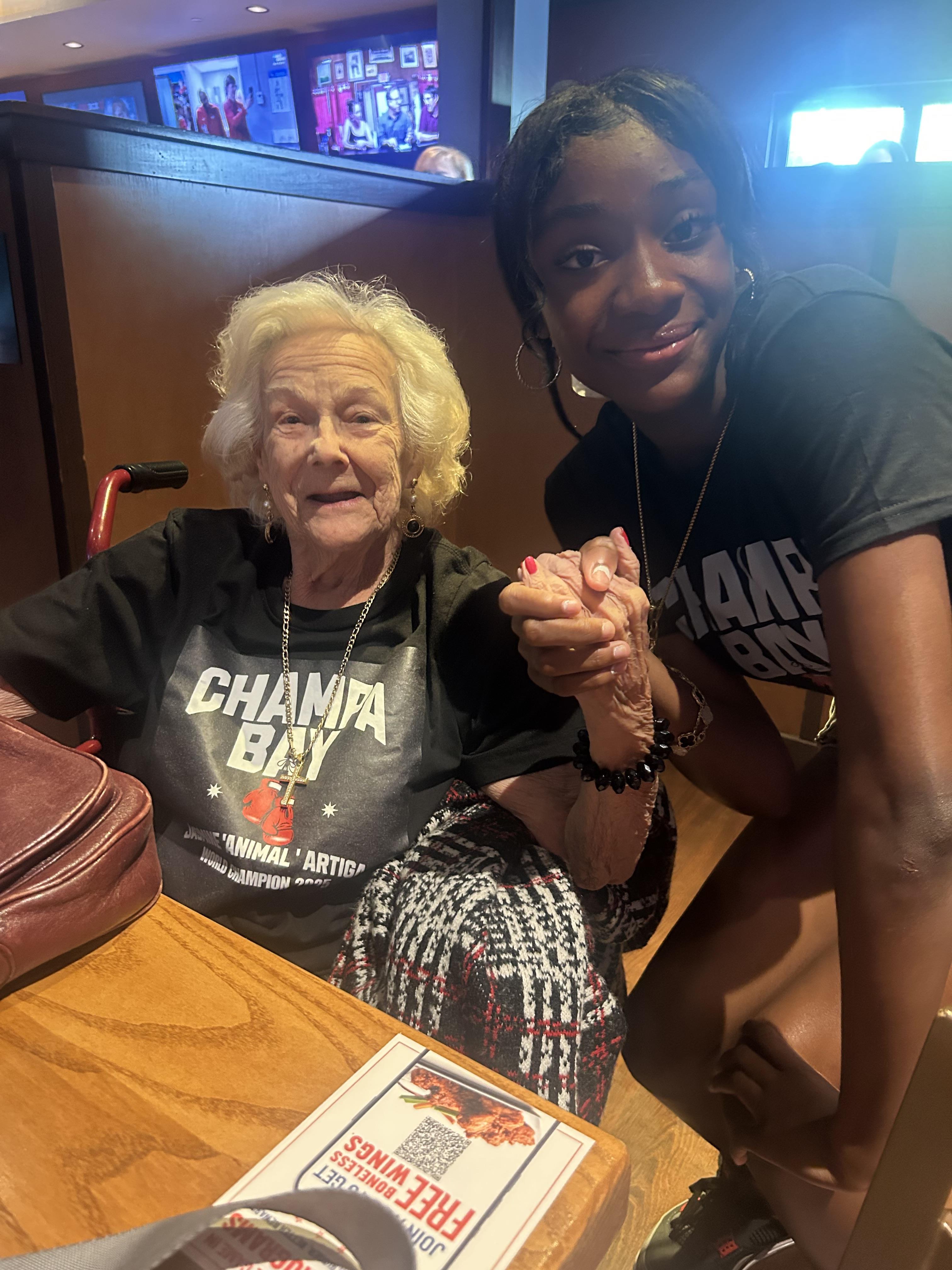 A woman holding a hand of another woman