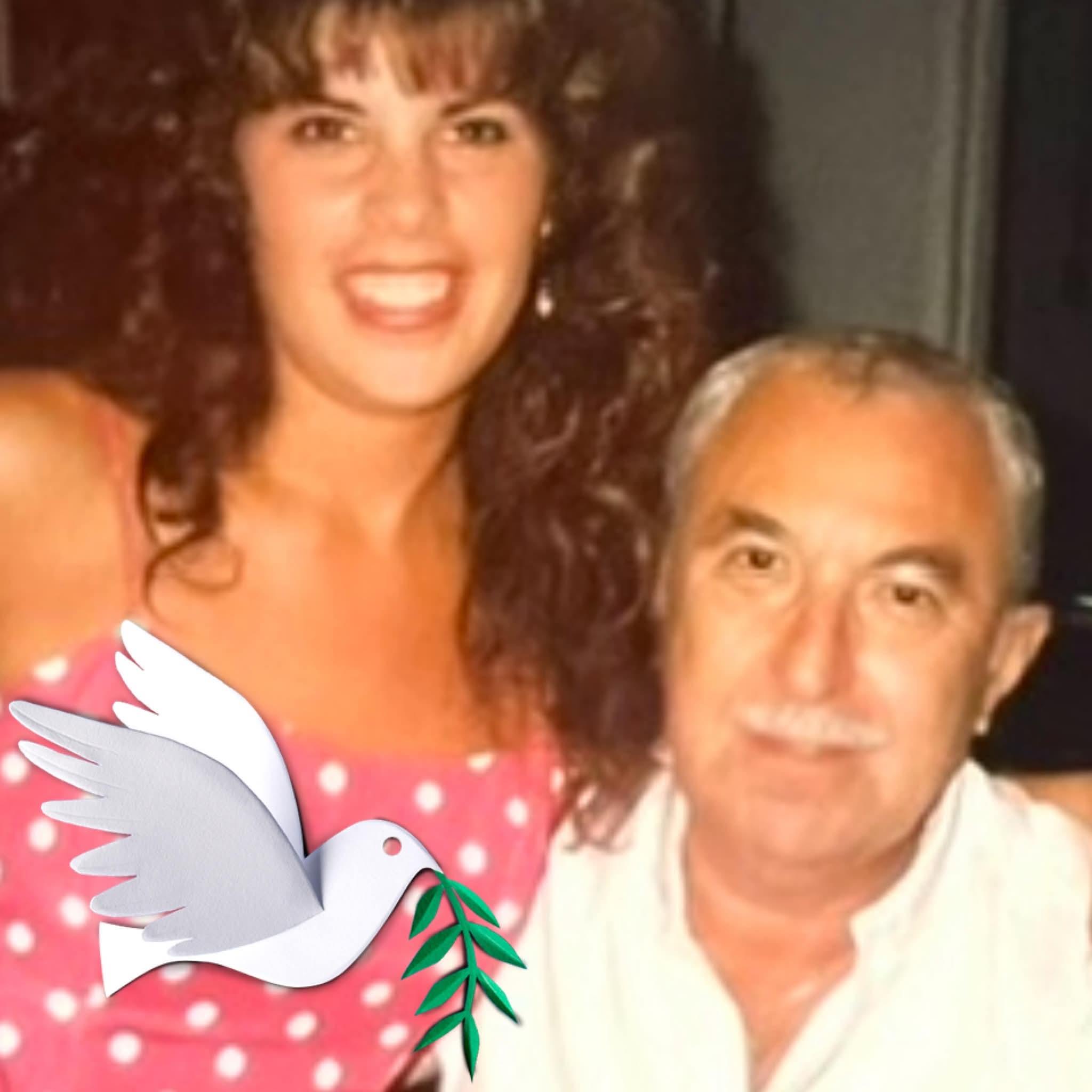 A woman and man posing for a picture