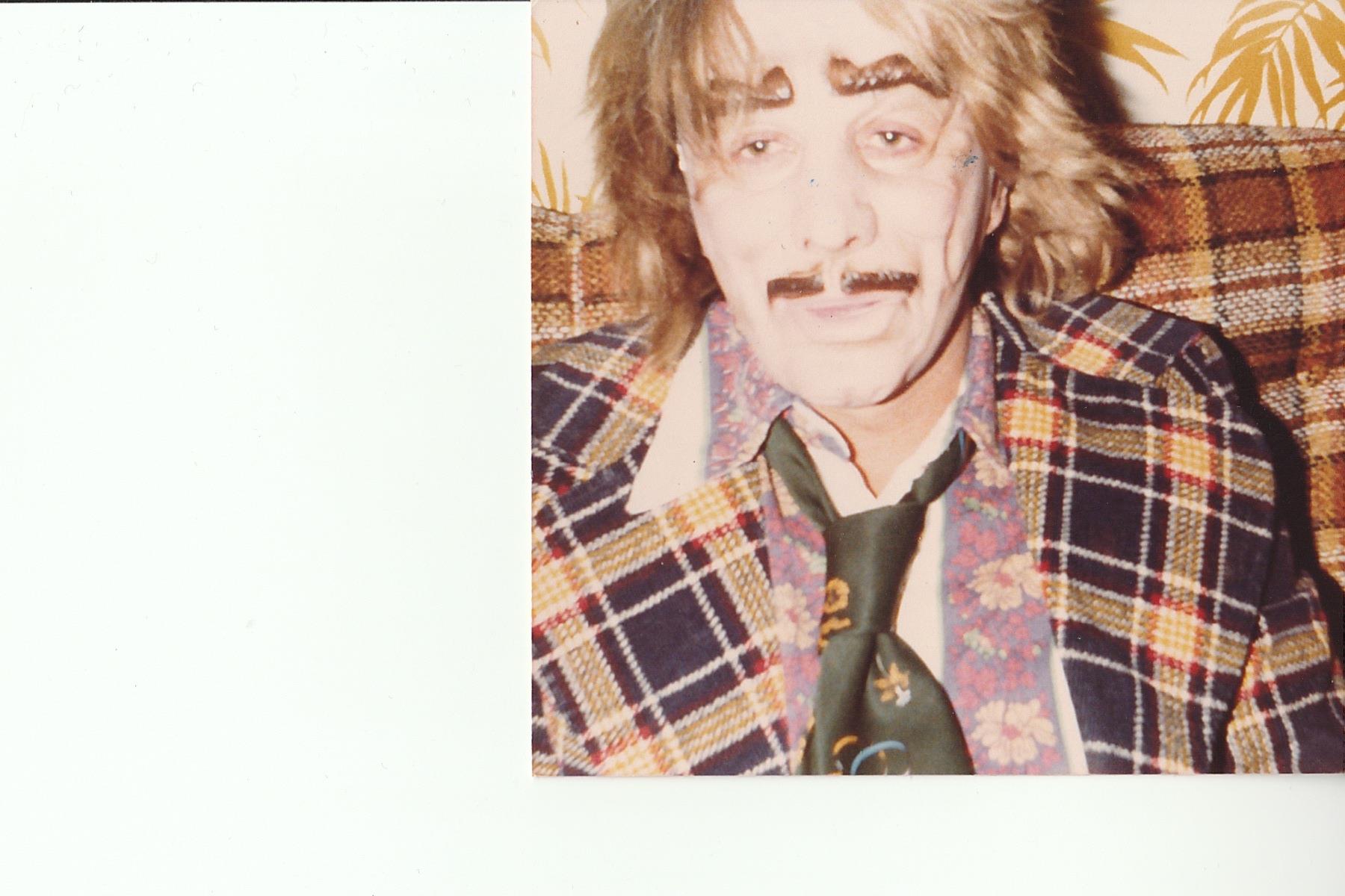 A man with mustache and tie