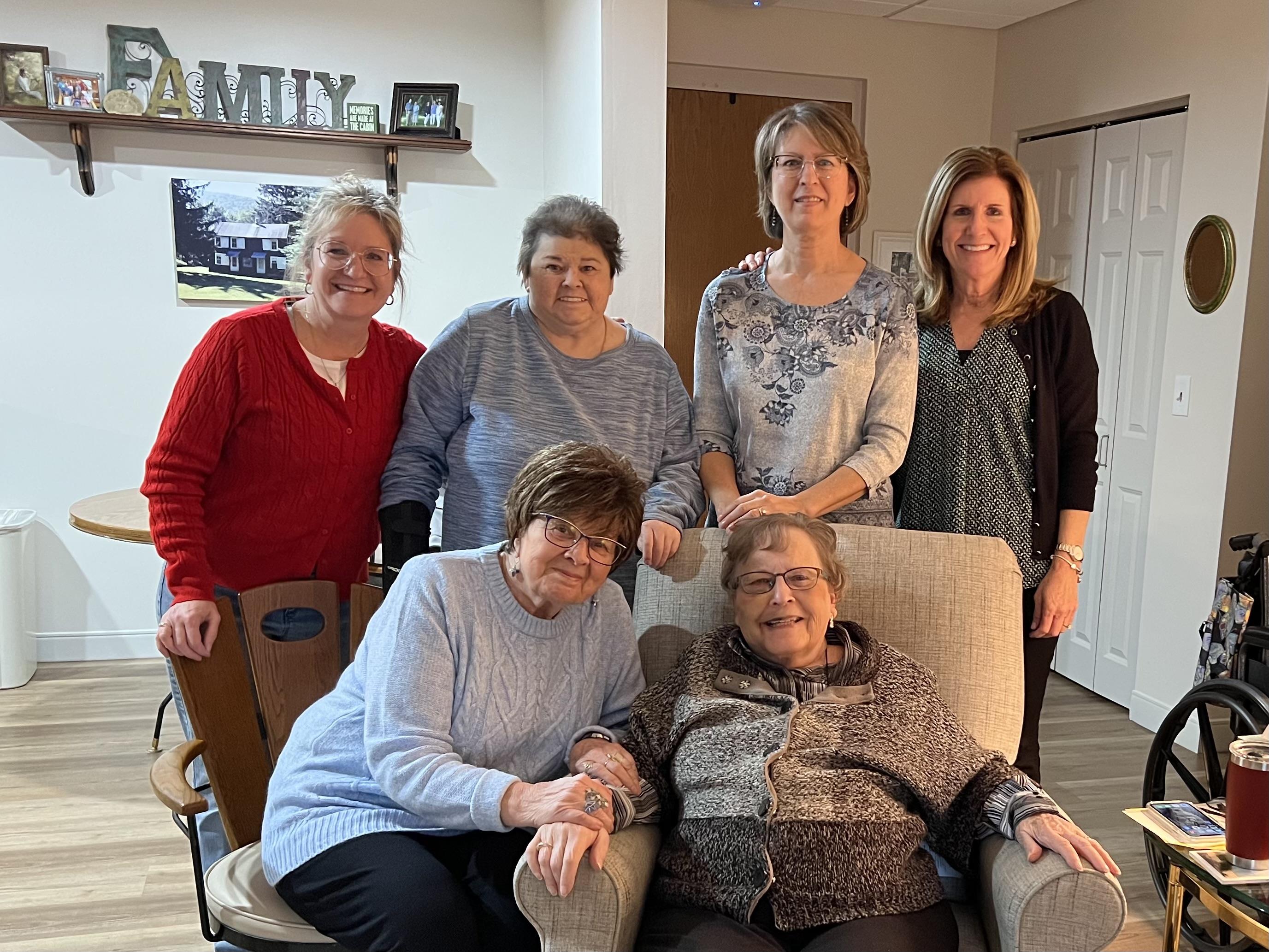 A group of women posing for a photo