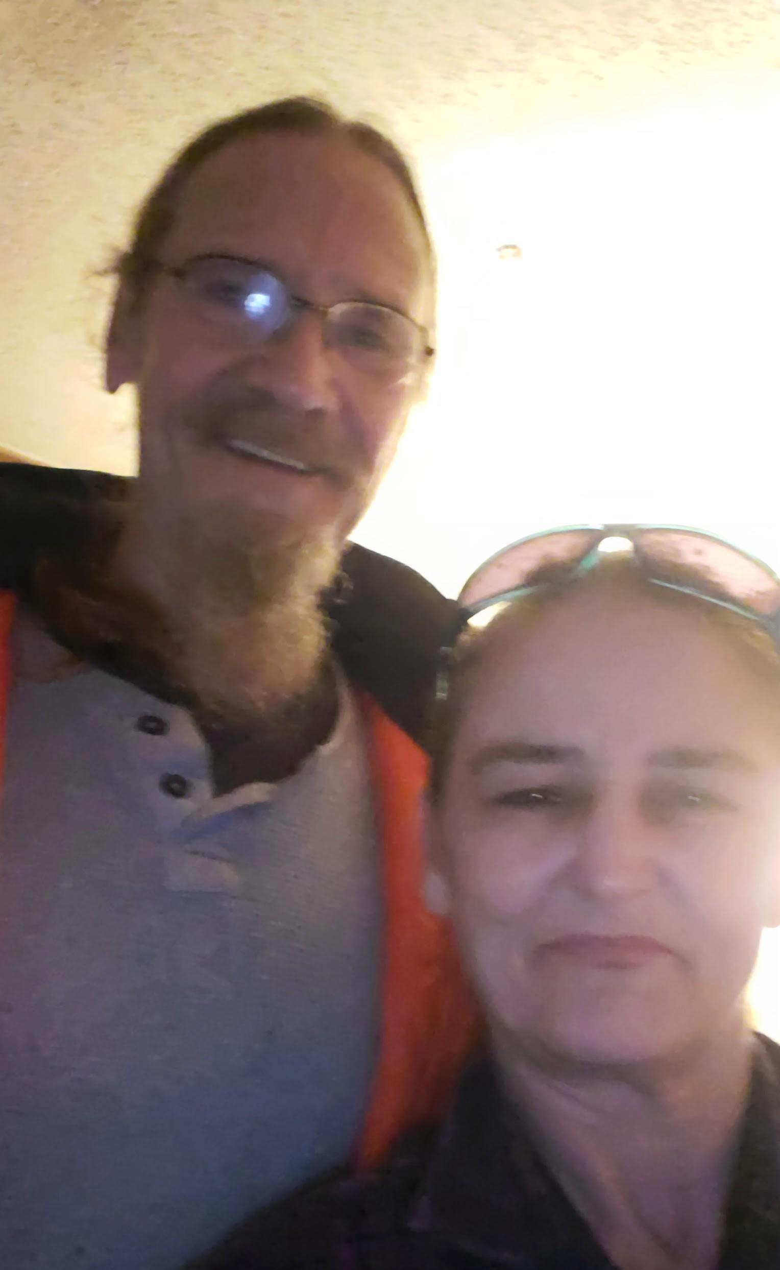 A man and woman taking a selfie