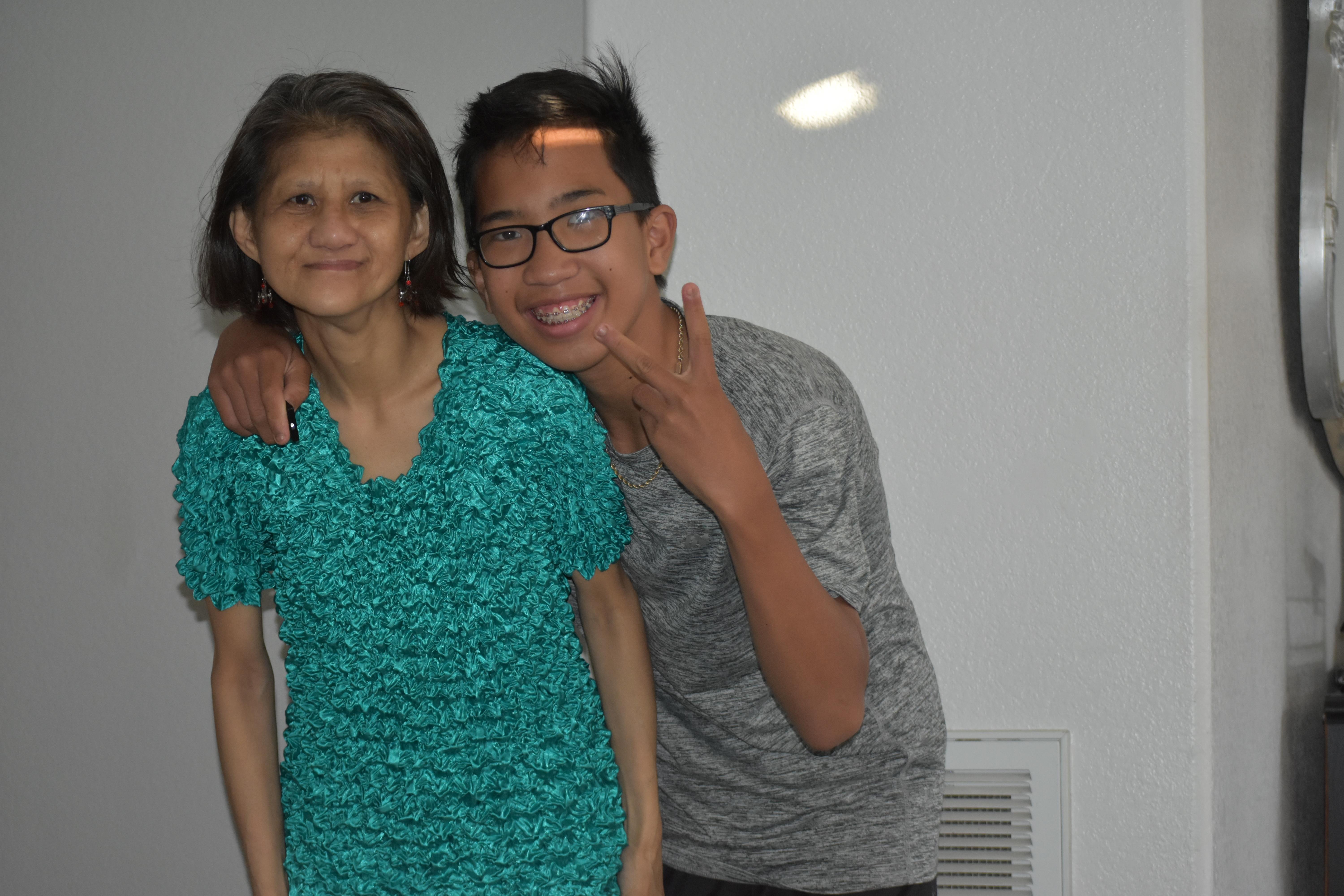 A man and woman posing for a picture