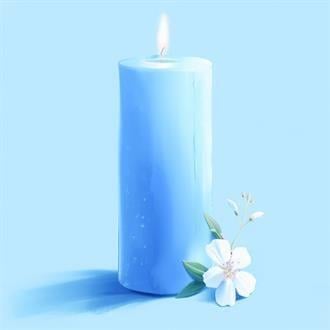 A blue candle with a white flower