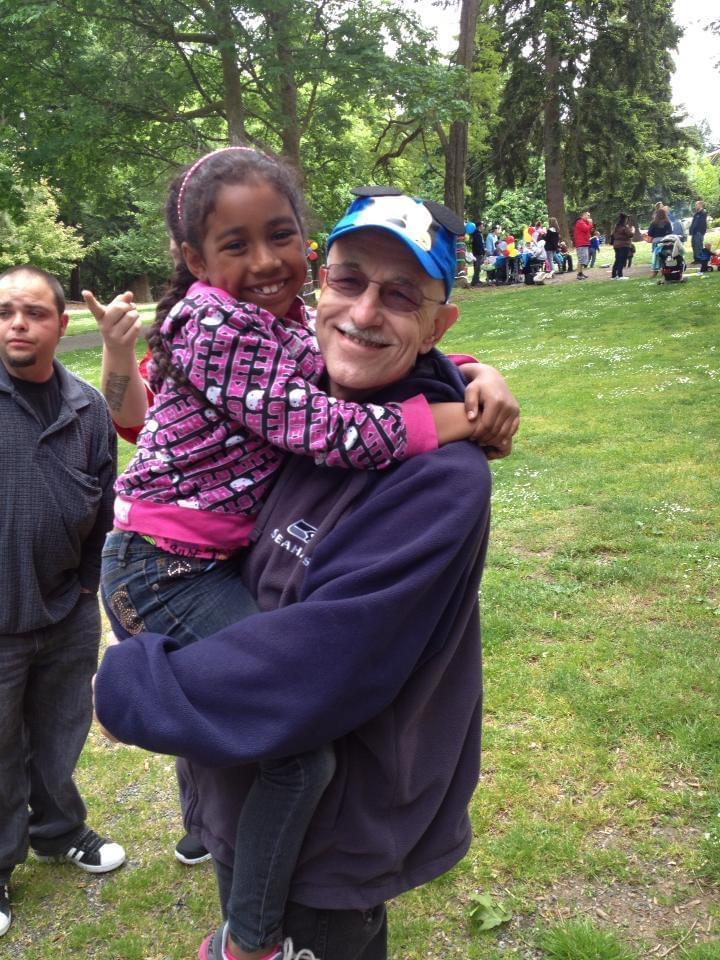 A man holding a girl