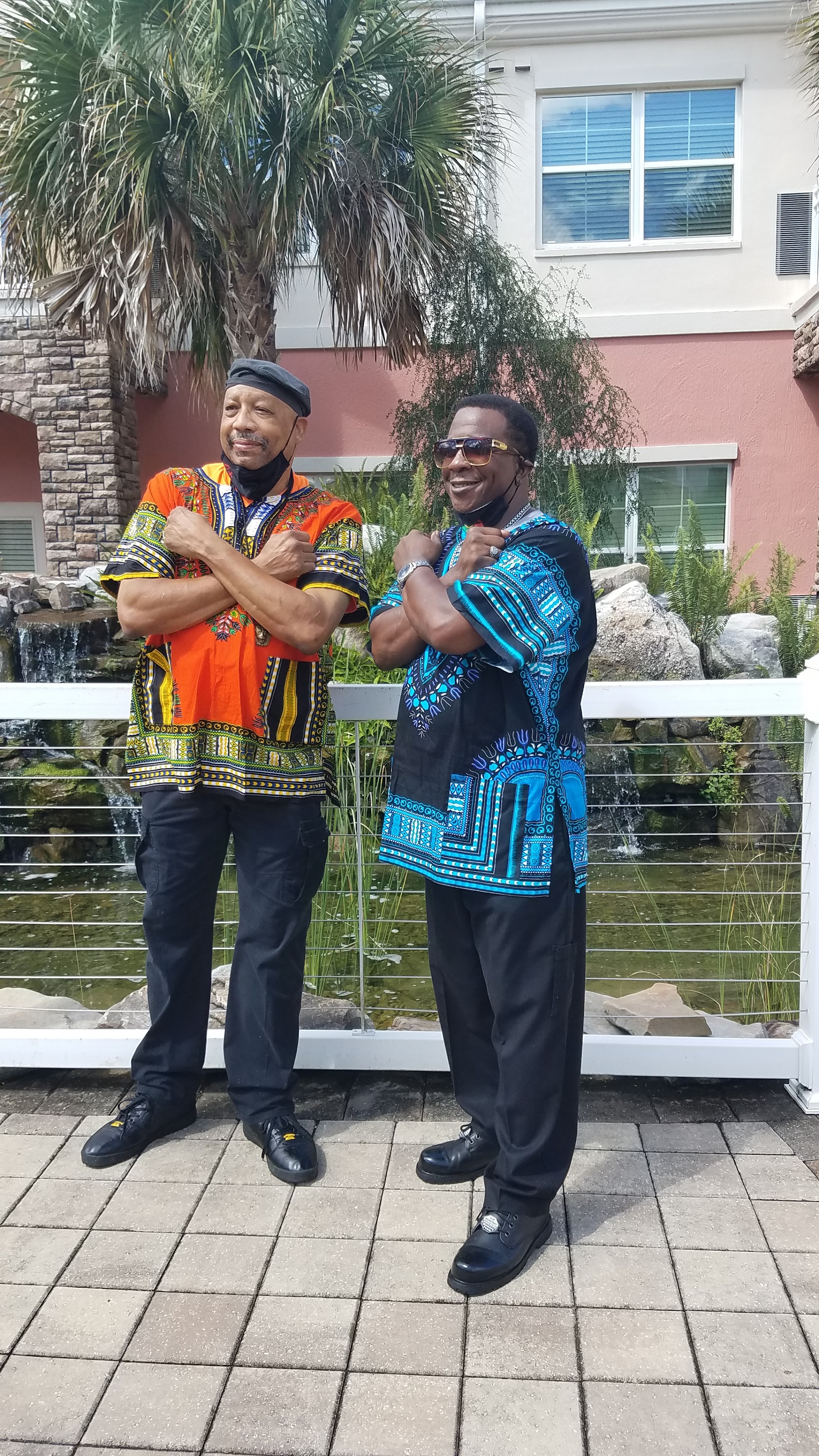 Two men standing next to each other