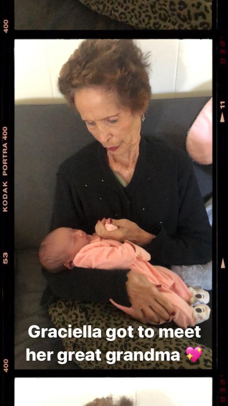 A woman holding a baby