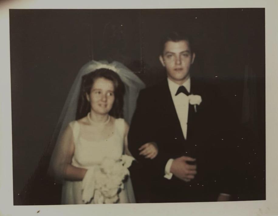 A man and woman in wedding attire