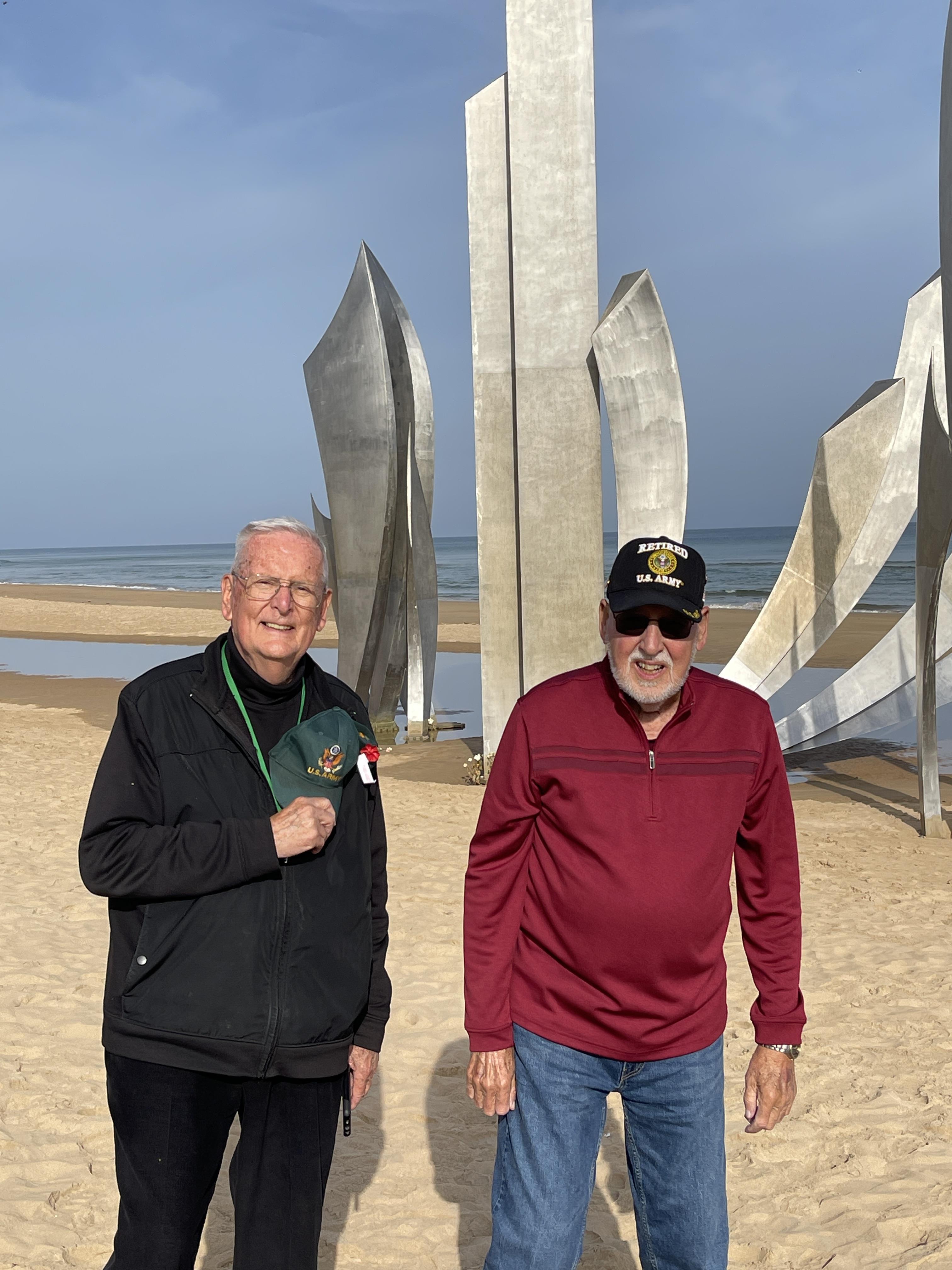 Two men standing on a beach