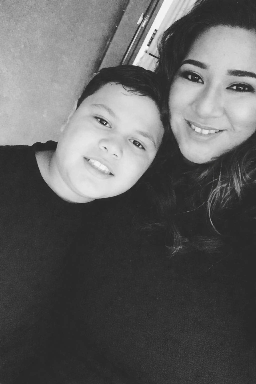 A woman and boy taking a selfie