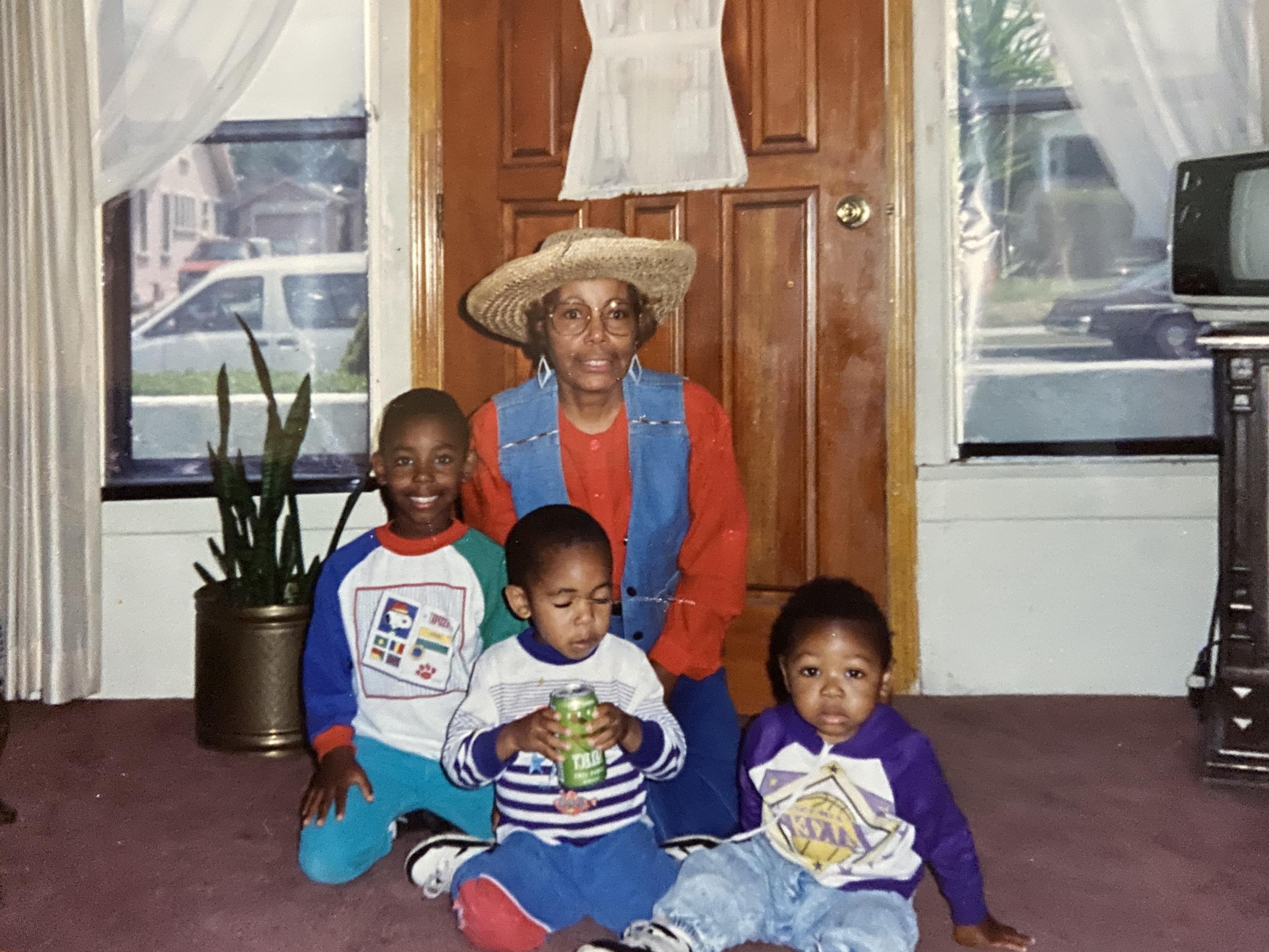 A woman and children sitting on the floor