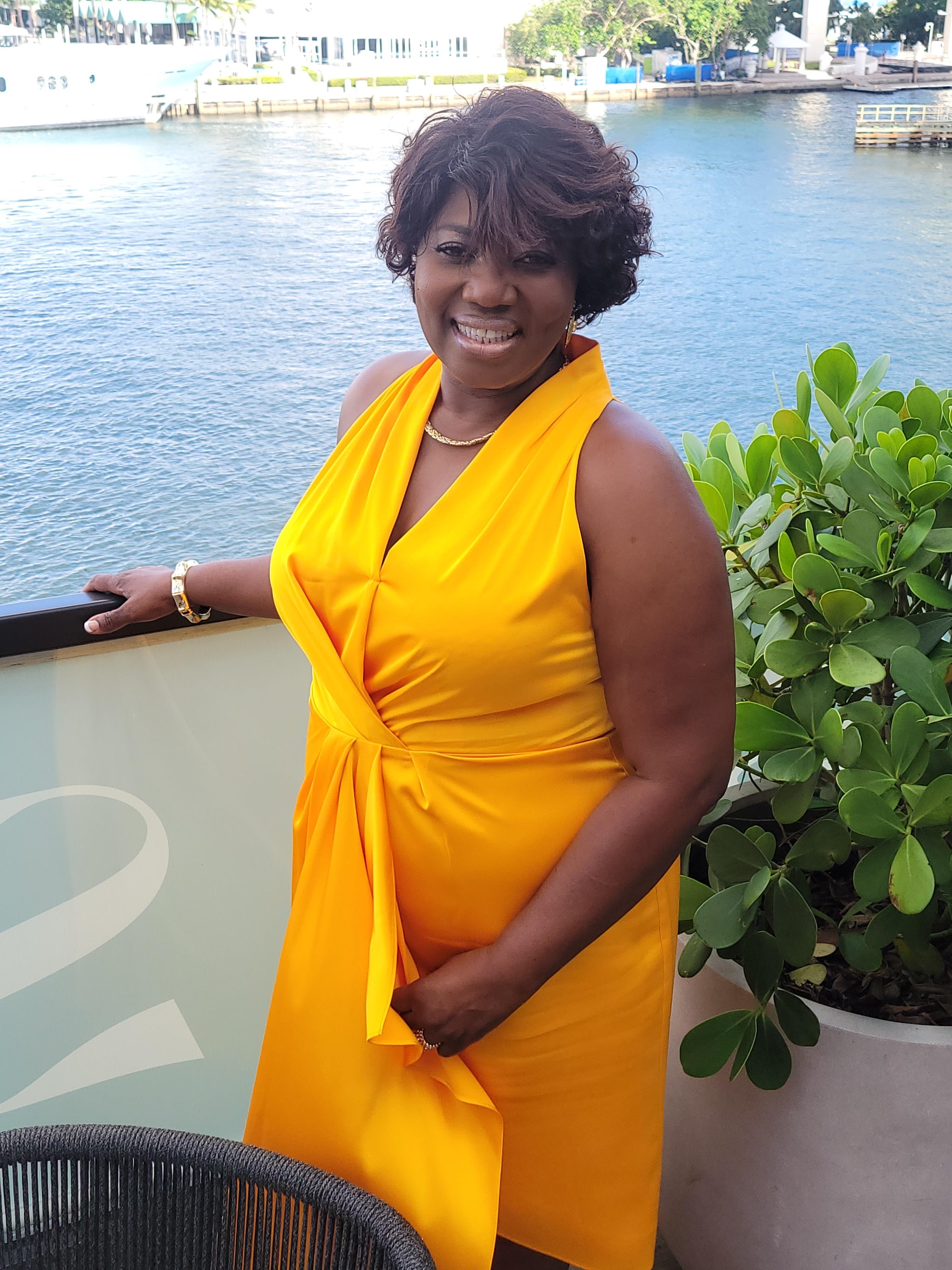 A woman in a yellow dress