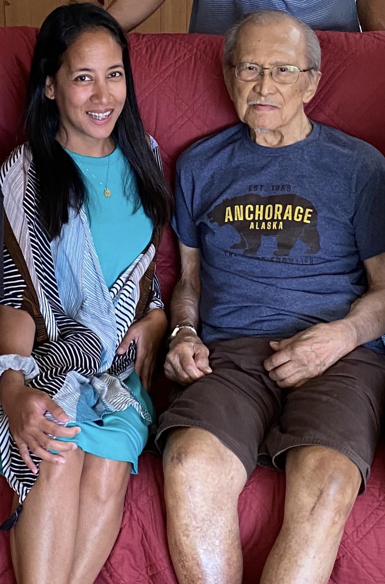 A man and woman sitting on a couch
