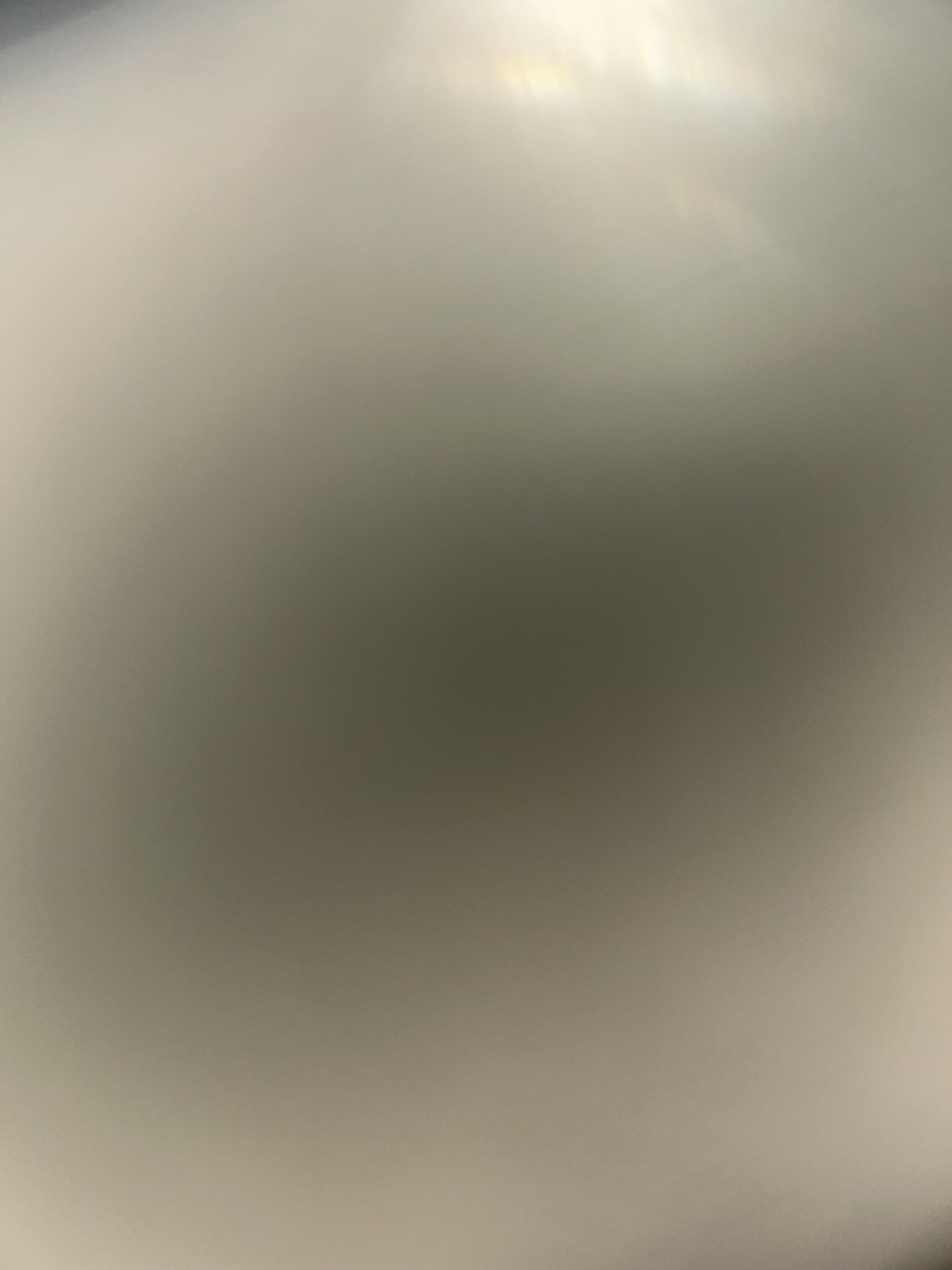 A blurry image of a black circle
