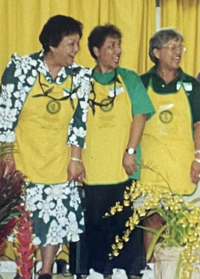A group of women wearing matching aprons