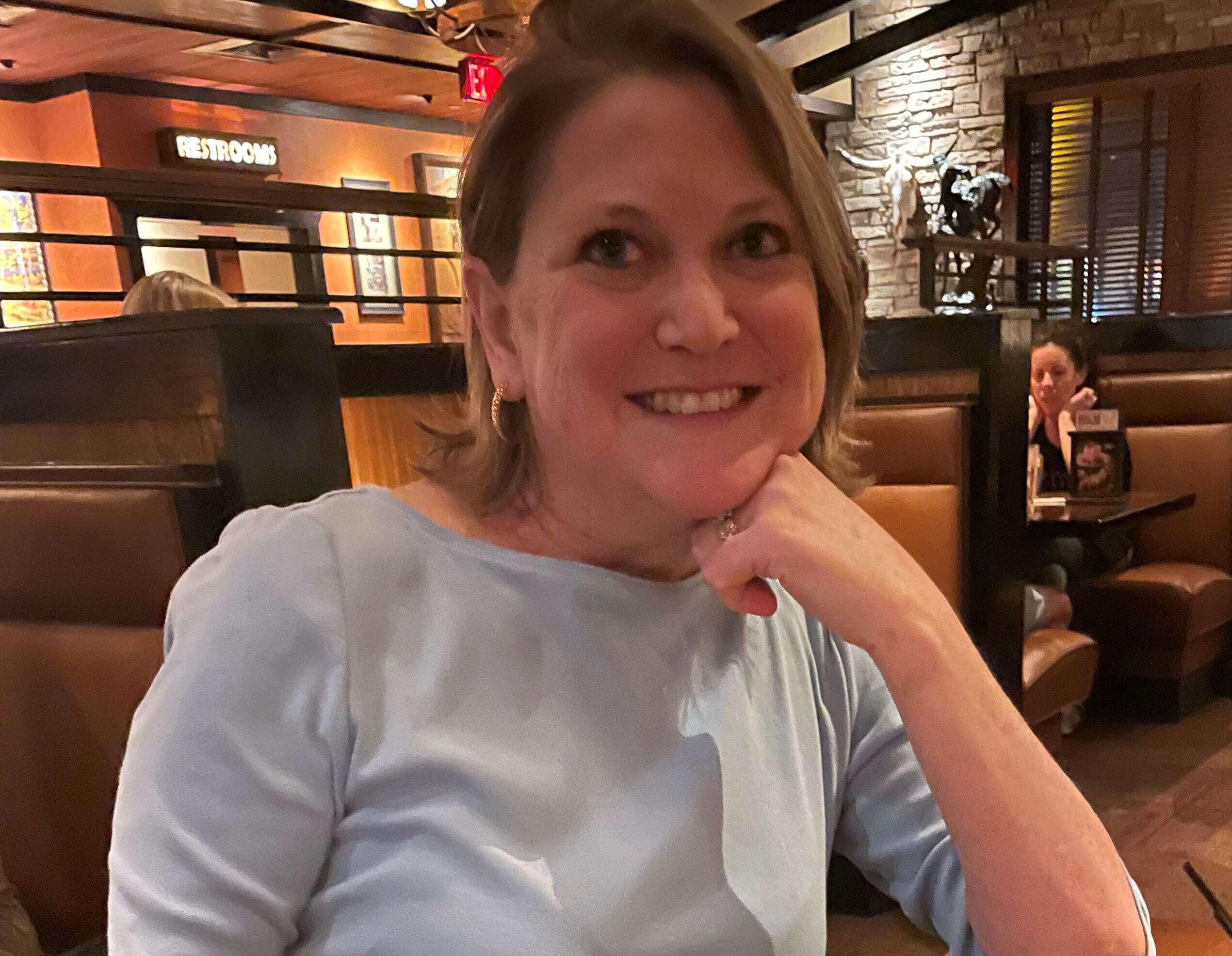 A woman sitting at a table