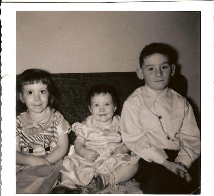 A group of children sitting on a couch