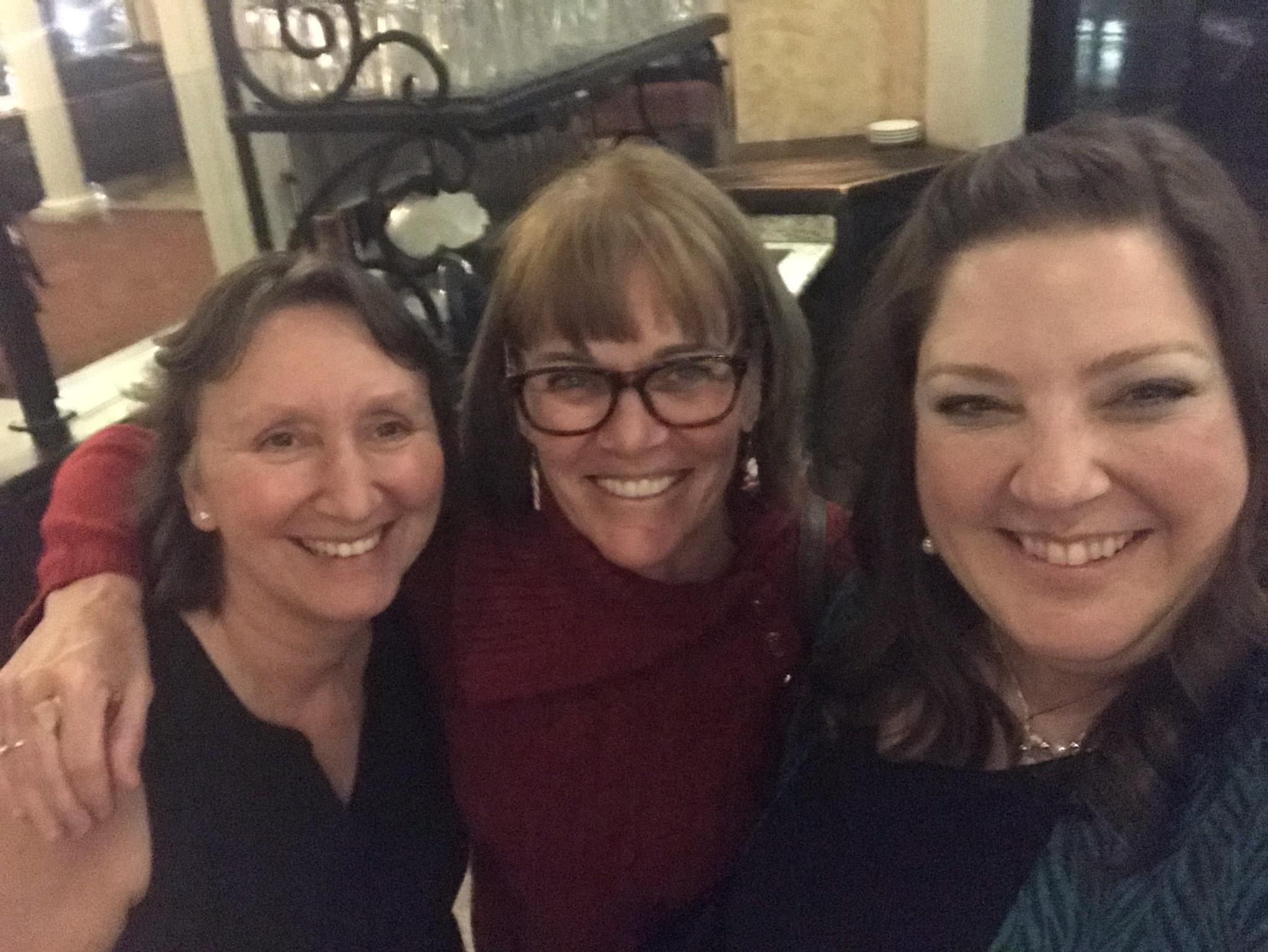 A group of women smiling for a photo