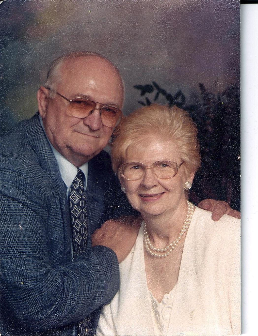 A man and woman posing for a picture