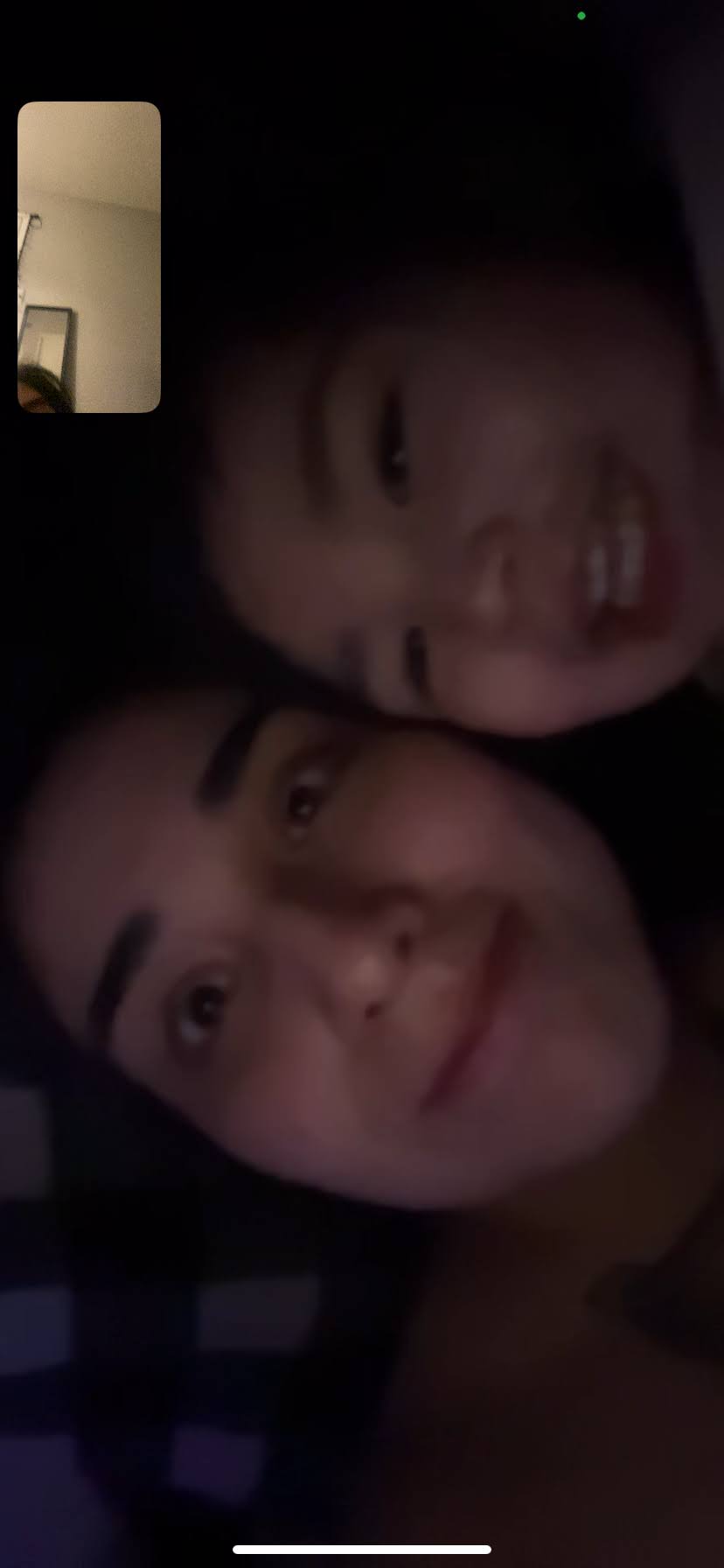 A couple of people taking a selfie