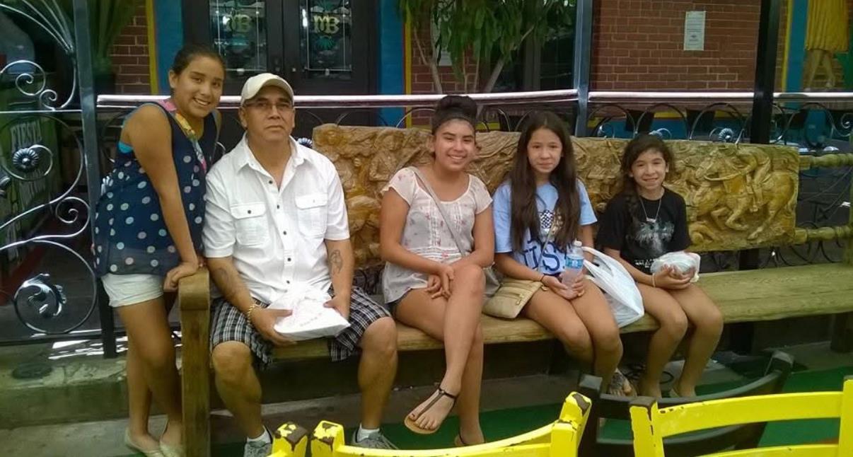 A group of people sitting on a bench