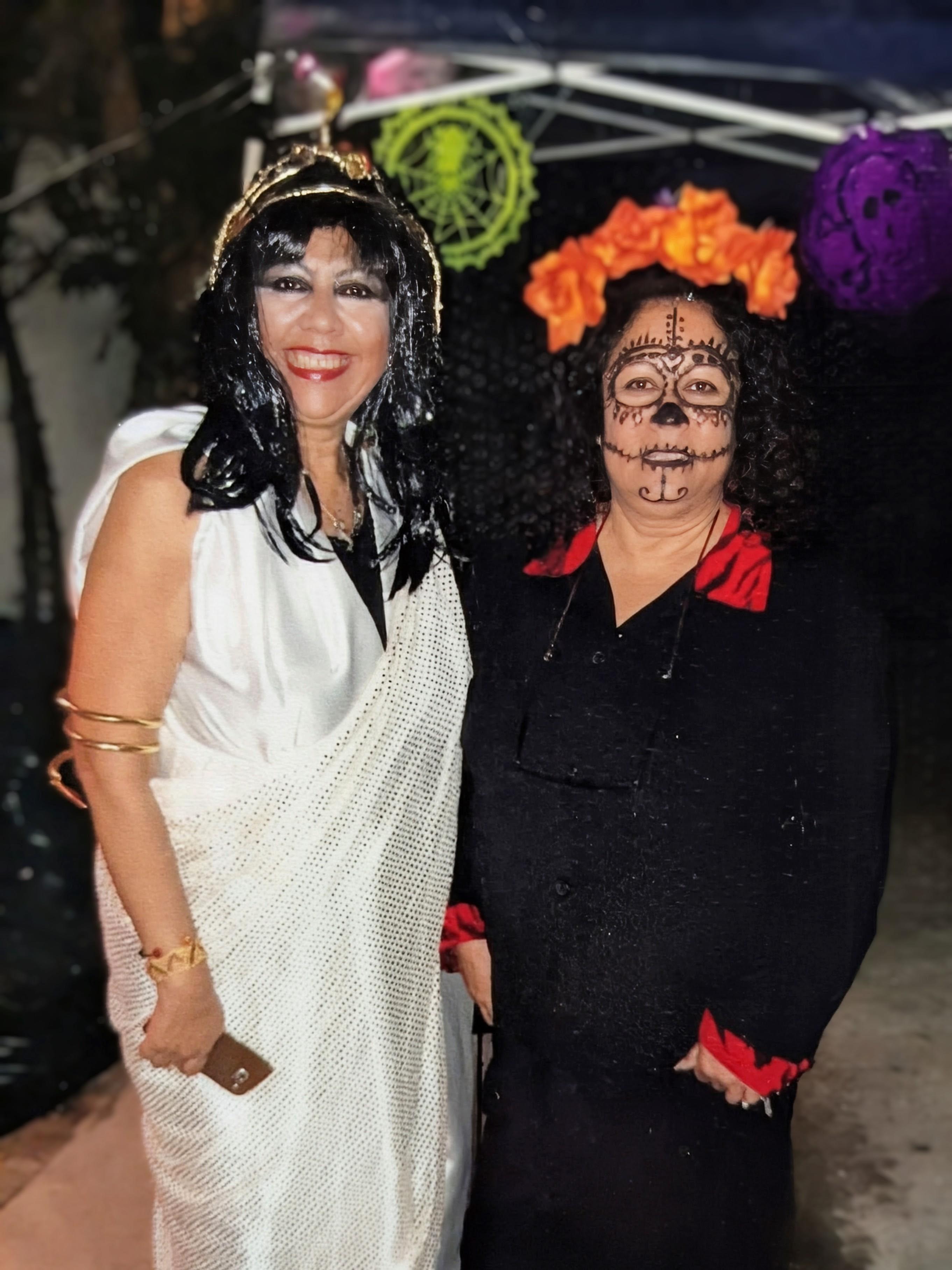 Two women in clothing posing for a photo