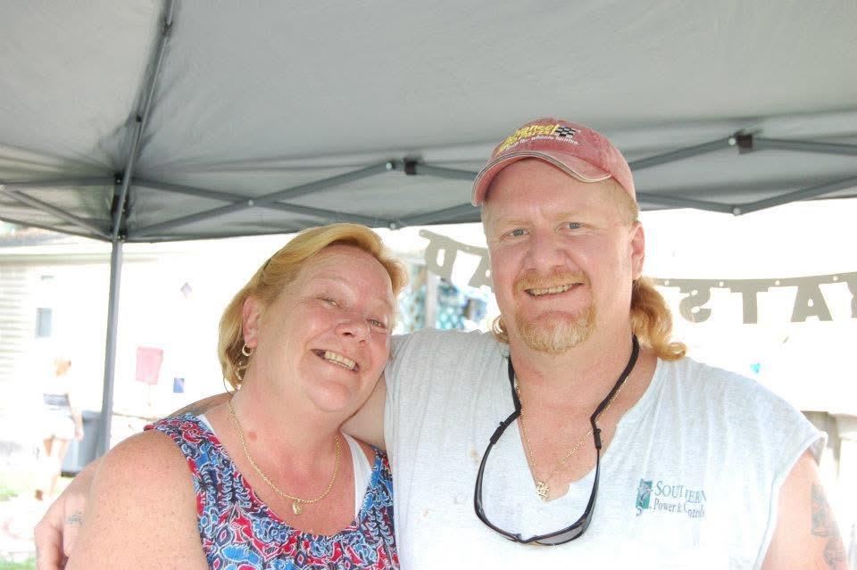 A man and woman smiling for a picture