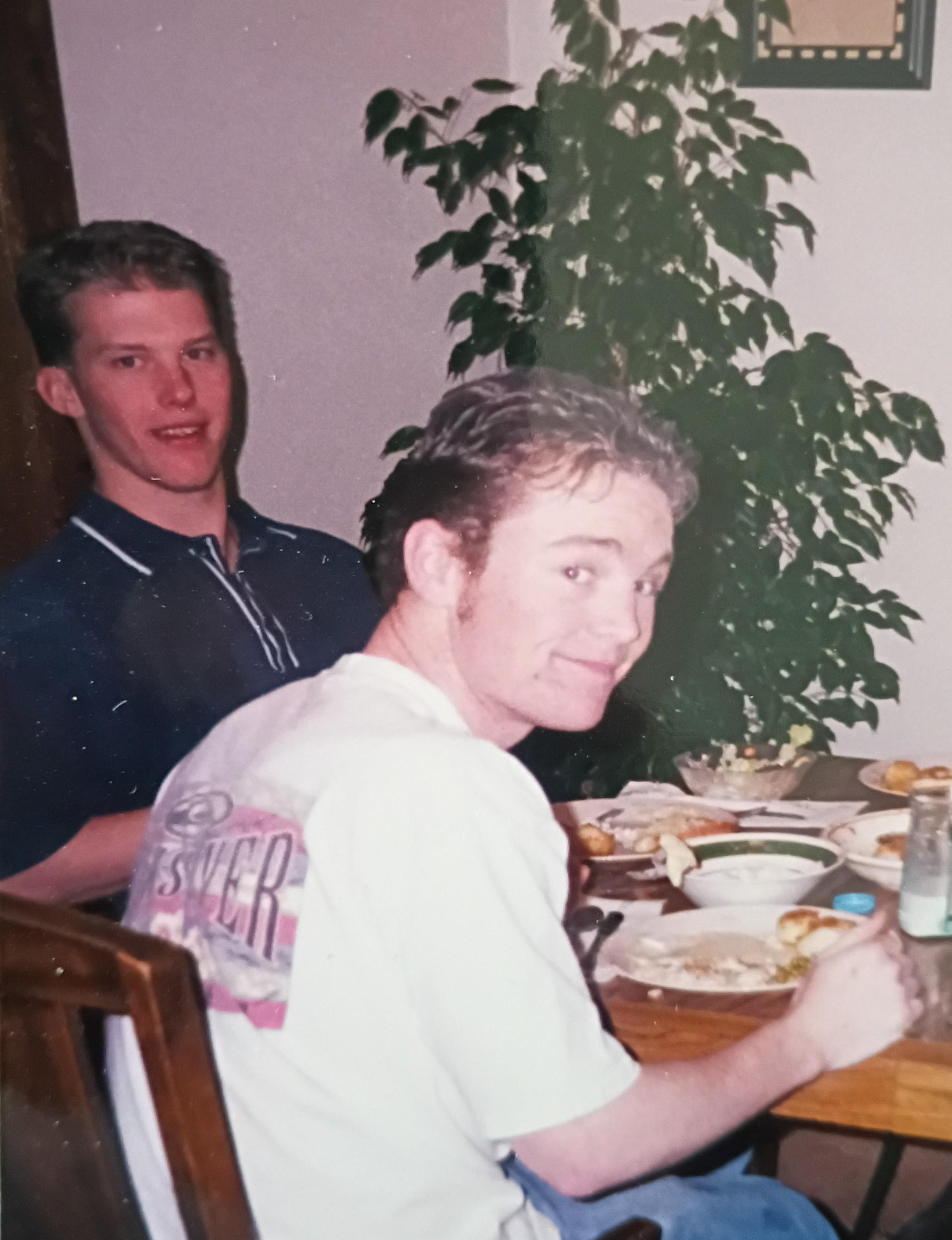 A group of men sitting at a table