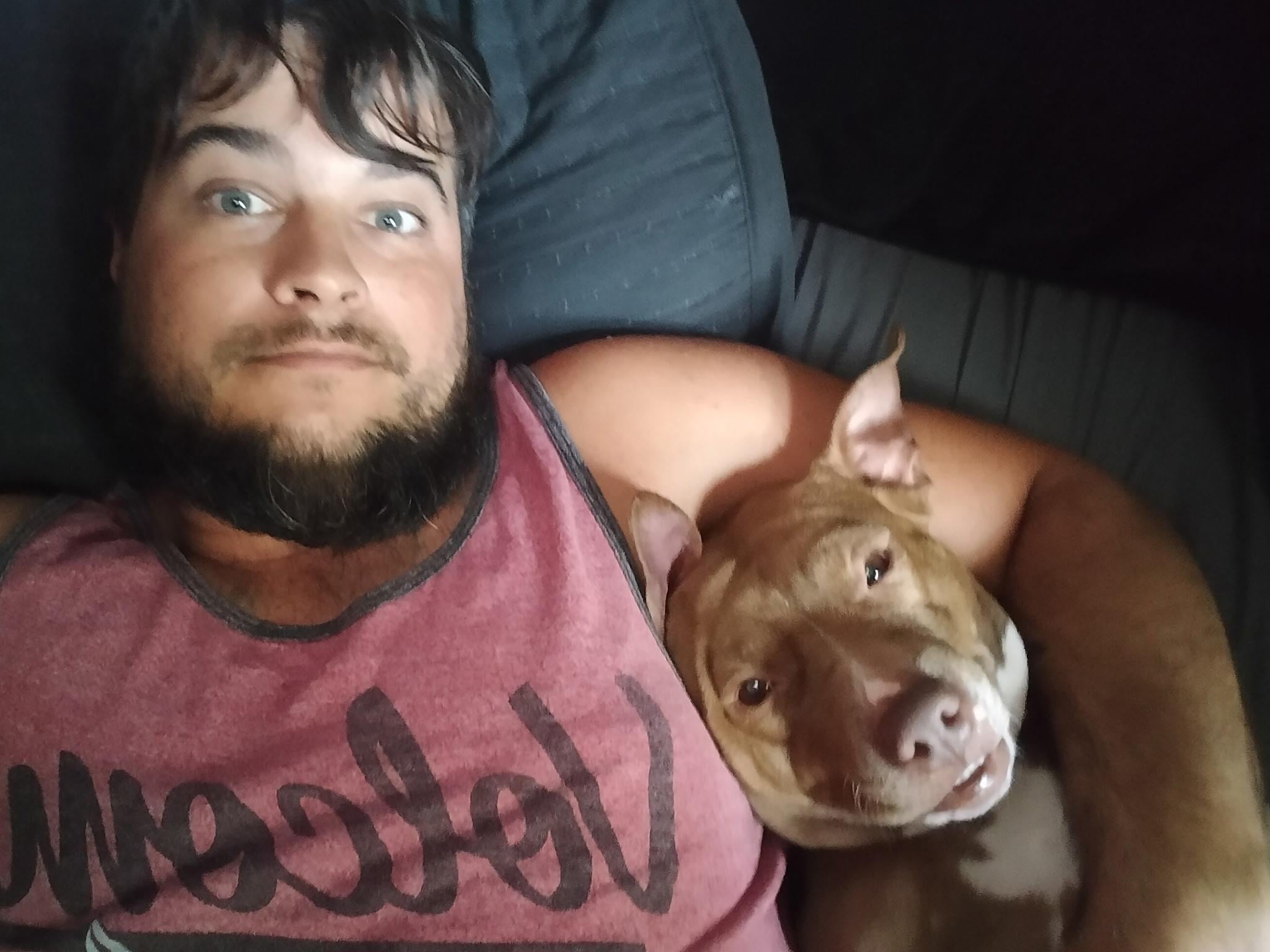 A man and dog taking a selfie