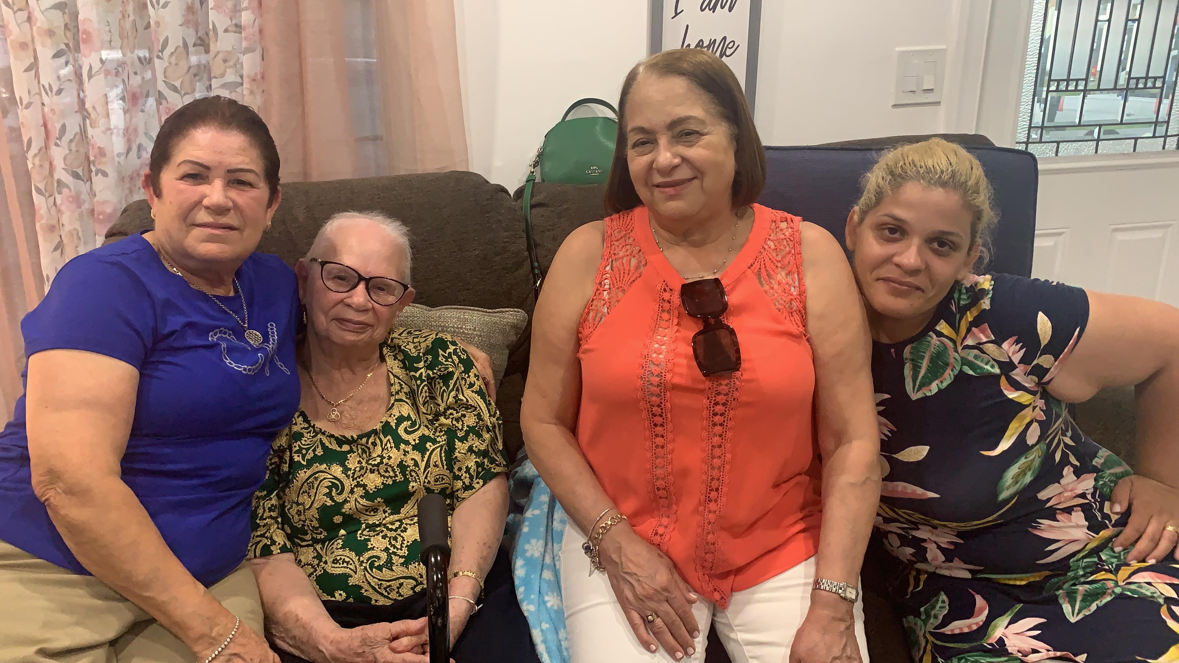 A group of women sitting on a couch