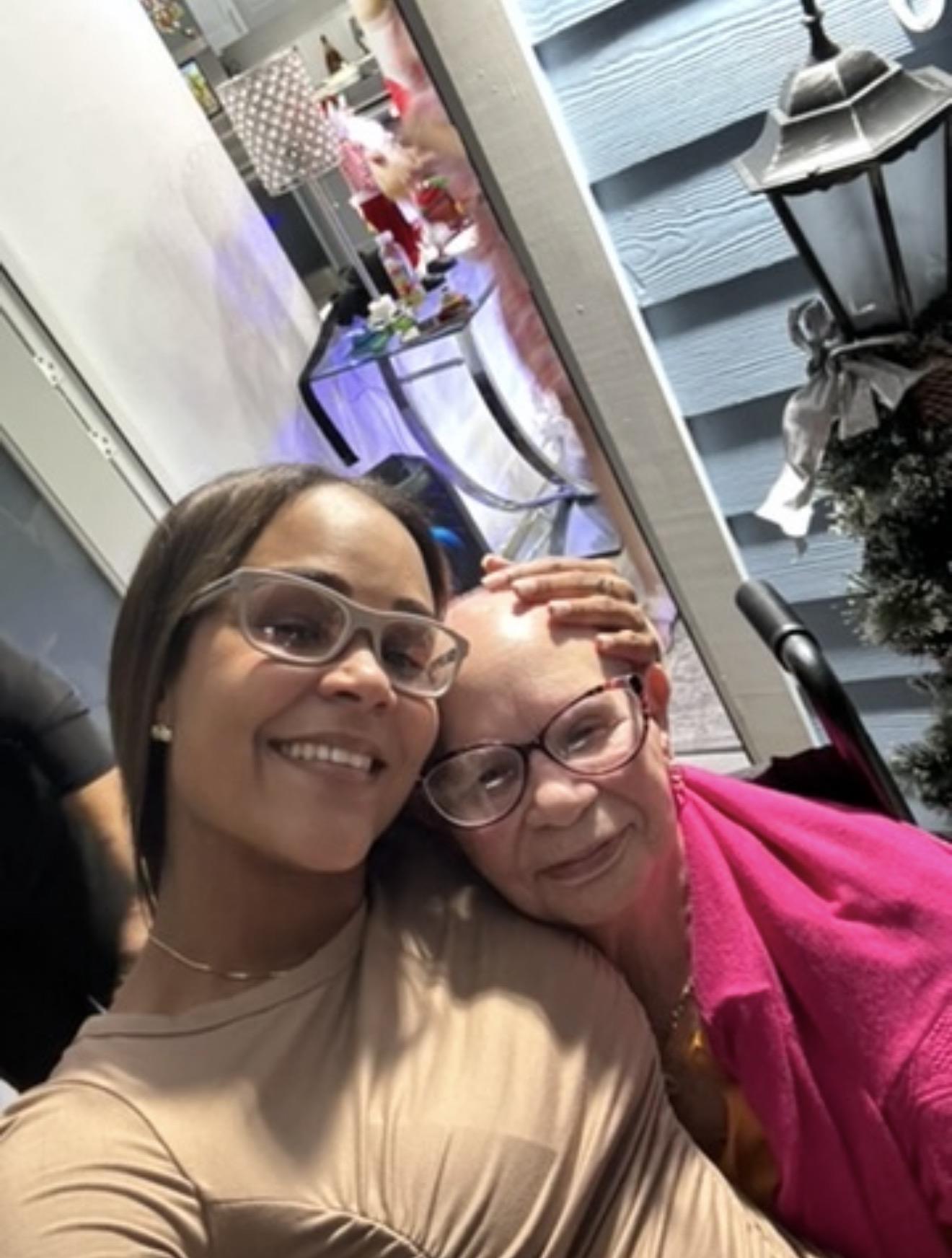 A woman taking a selfie with a woman