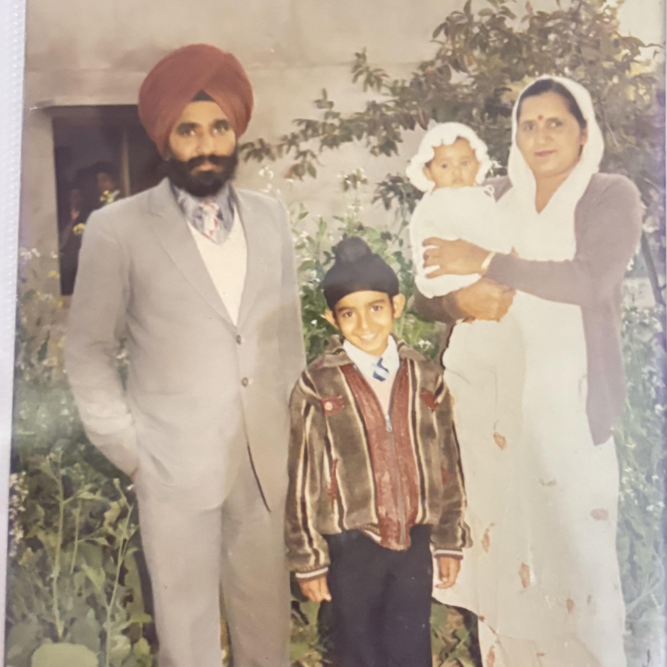 A man and woman with a child and a baby